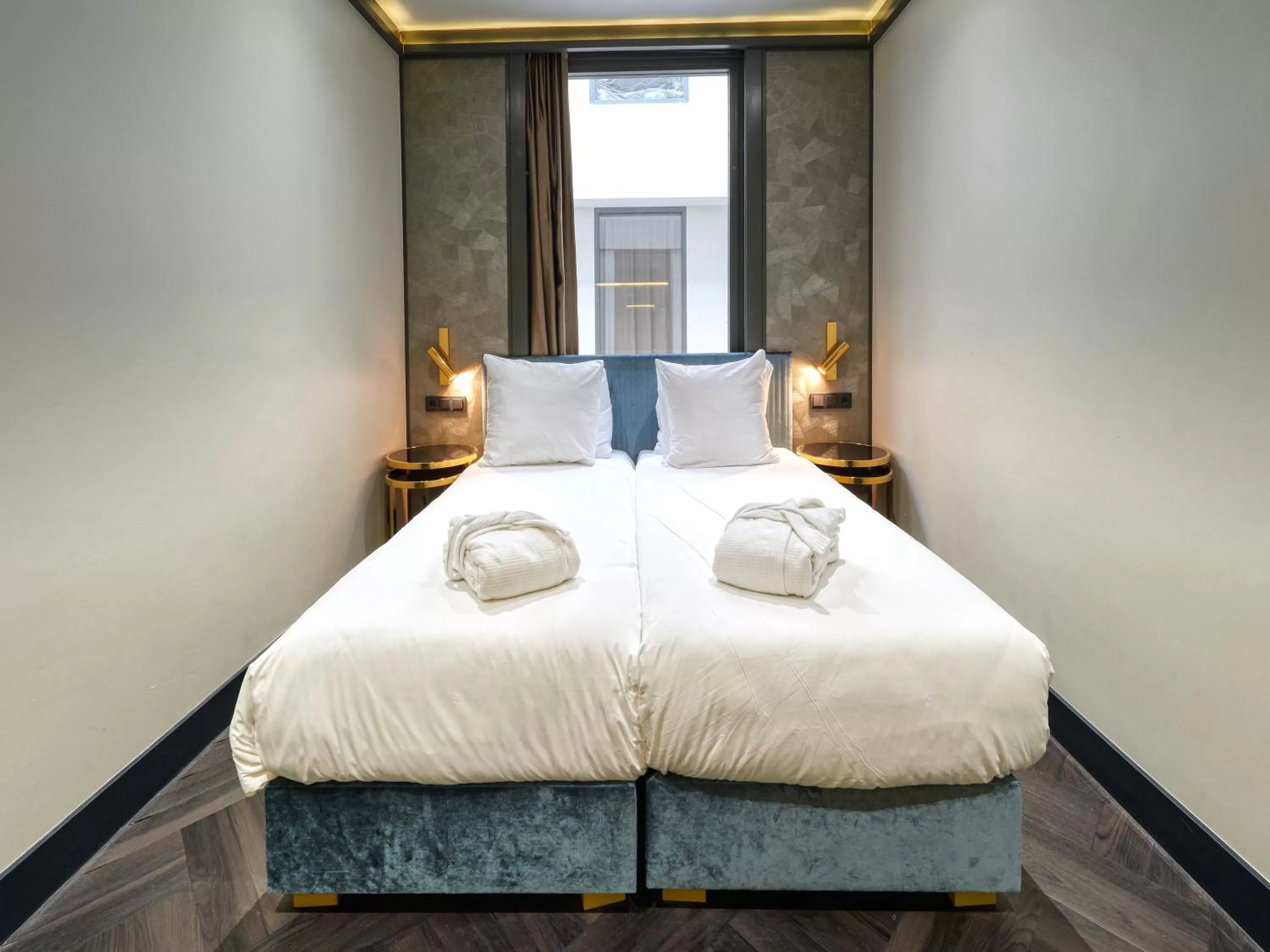 Bed in Triple G Hotels