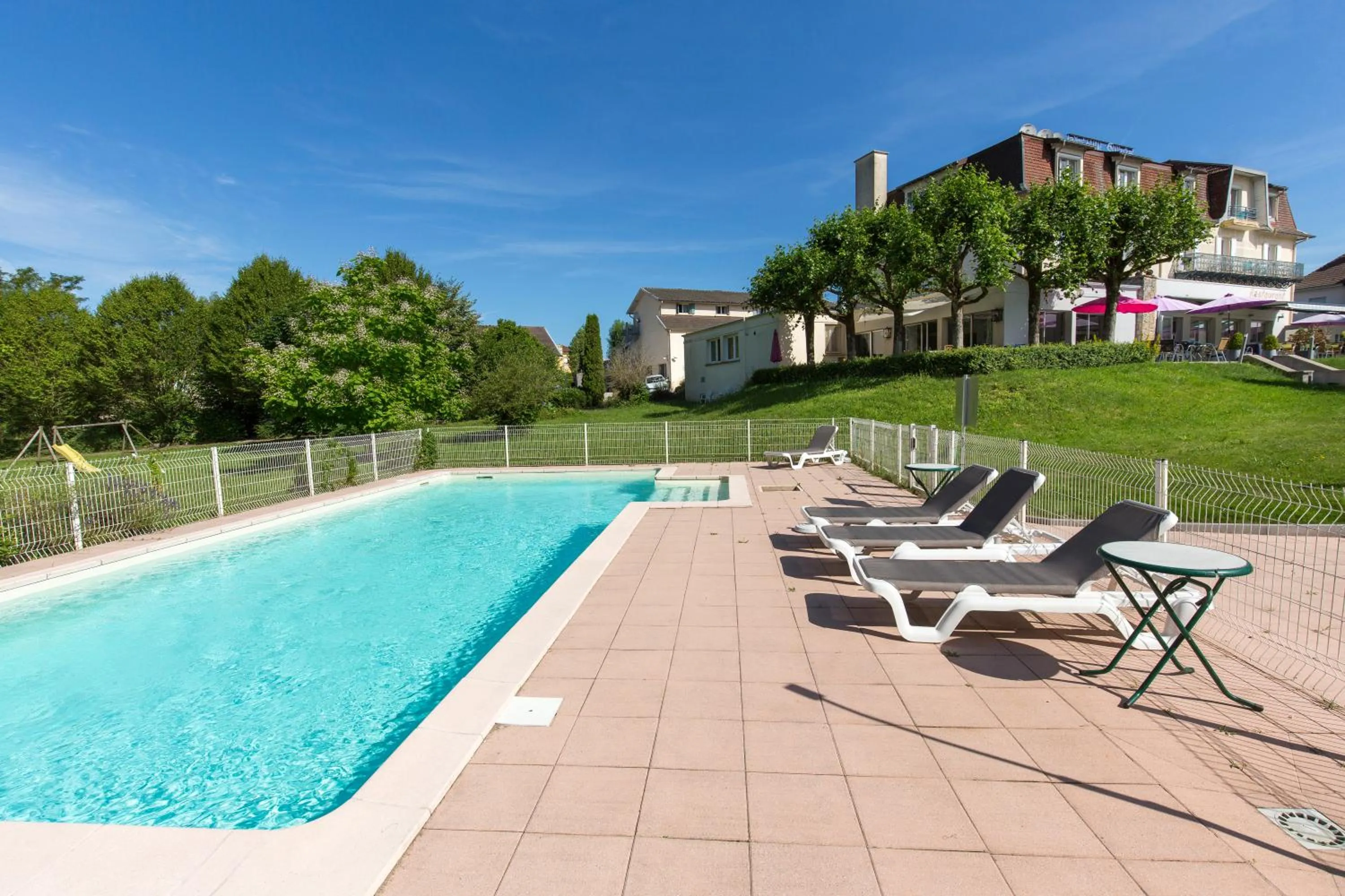 Swimming pool in Logis Hotel Restaurant Spa Beau Site