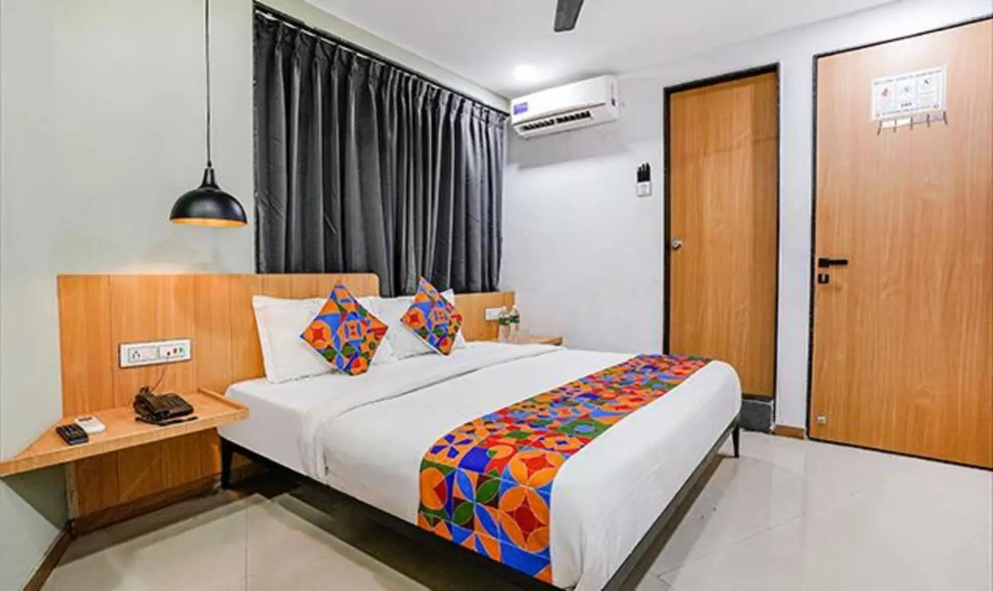 Bed in FabHotel Saarthi Inn