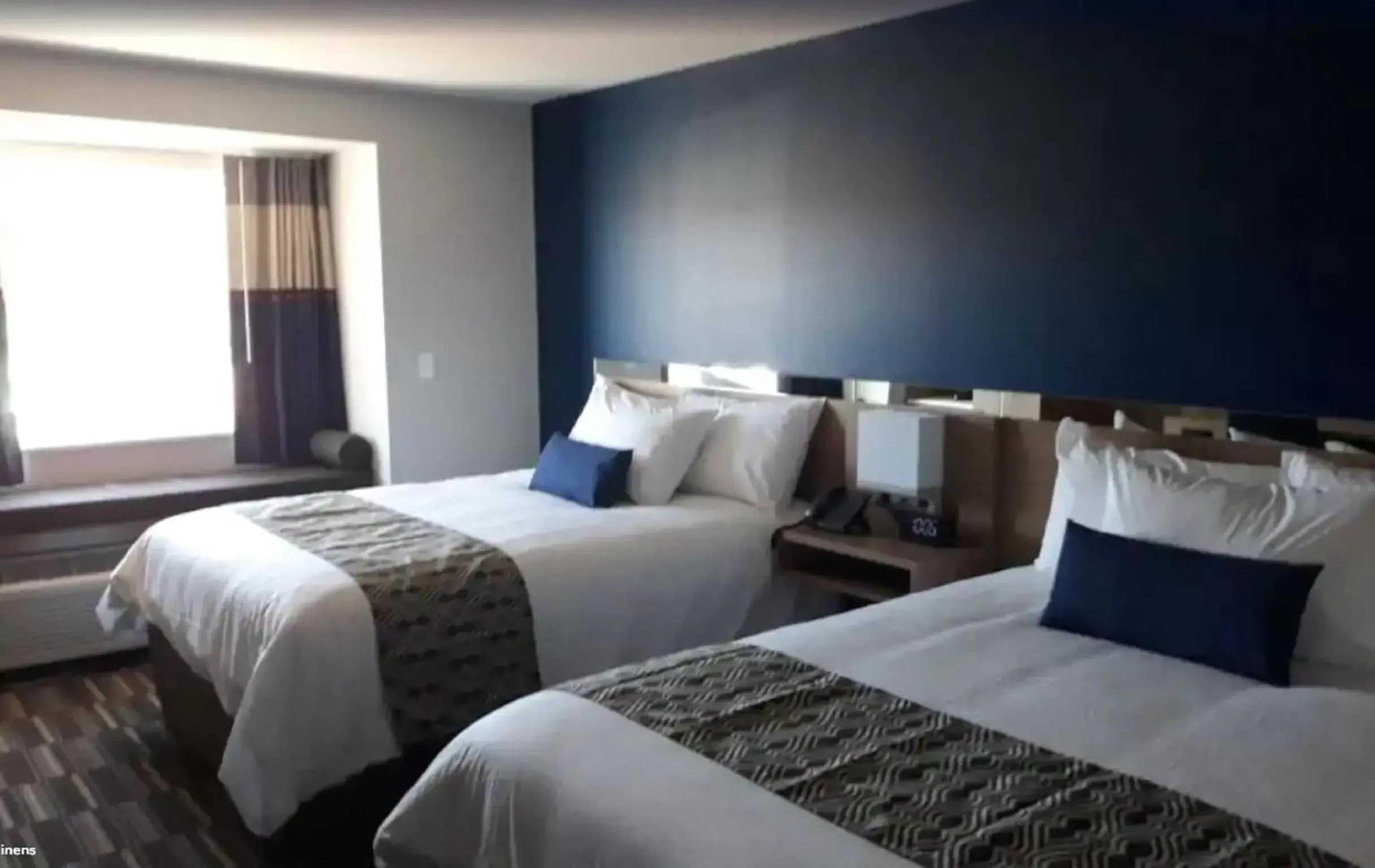 Bed in Microtel Inn & Suites by Wyndham Woodland Park