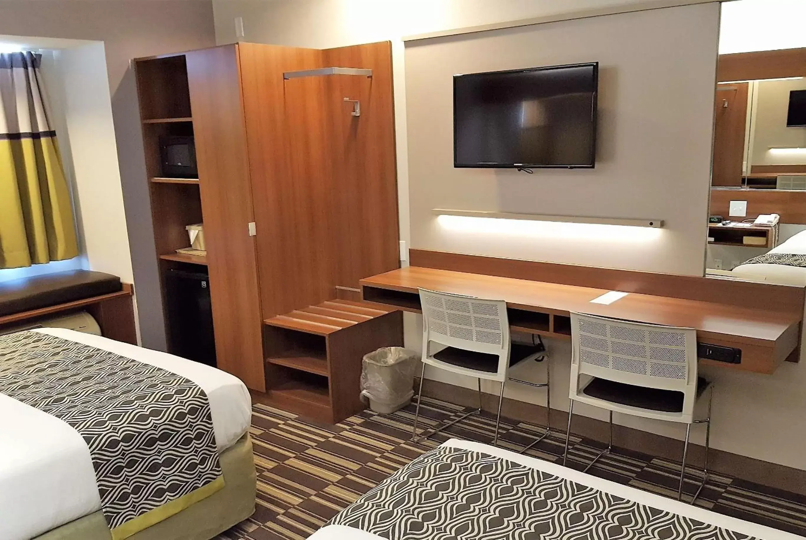Photo of the whole room, TV/Entertainment Center in Microtel Inn & Suites by Wyndham Bellevue