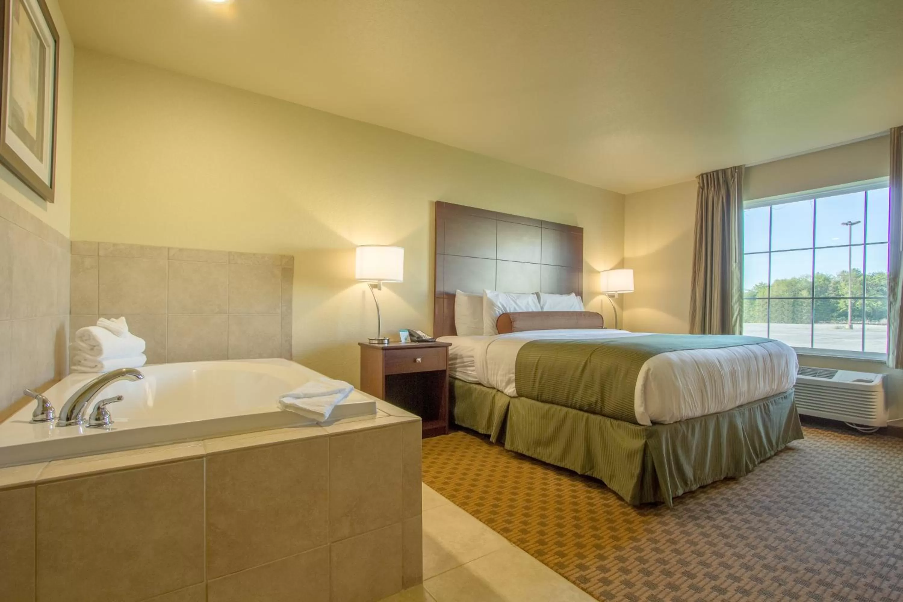 Bed in Cobblestone Inn & Suites - Corry