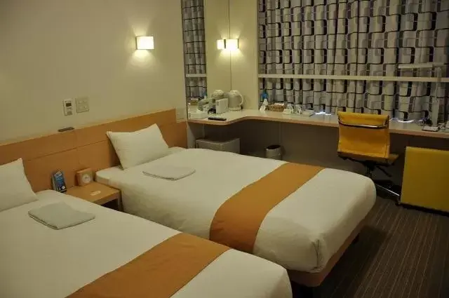 Bed in Smile Hotel Matsuyama