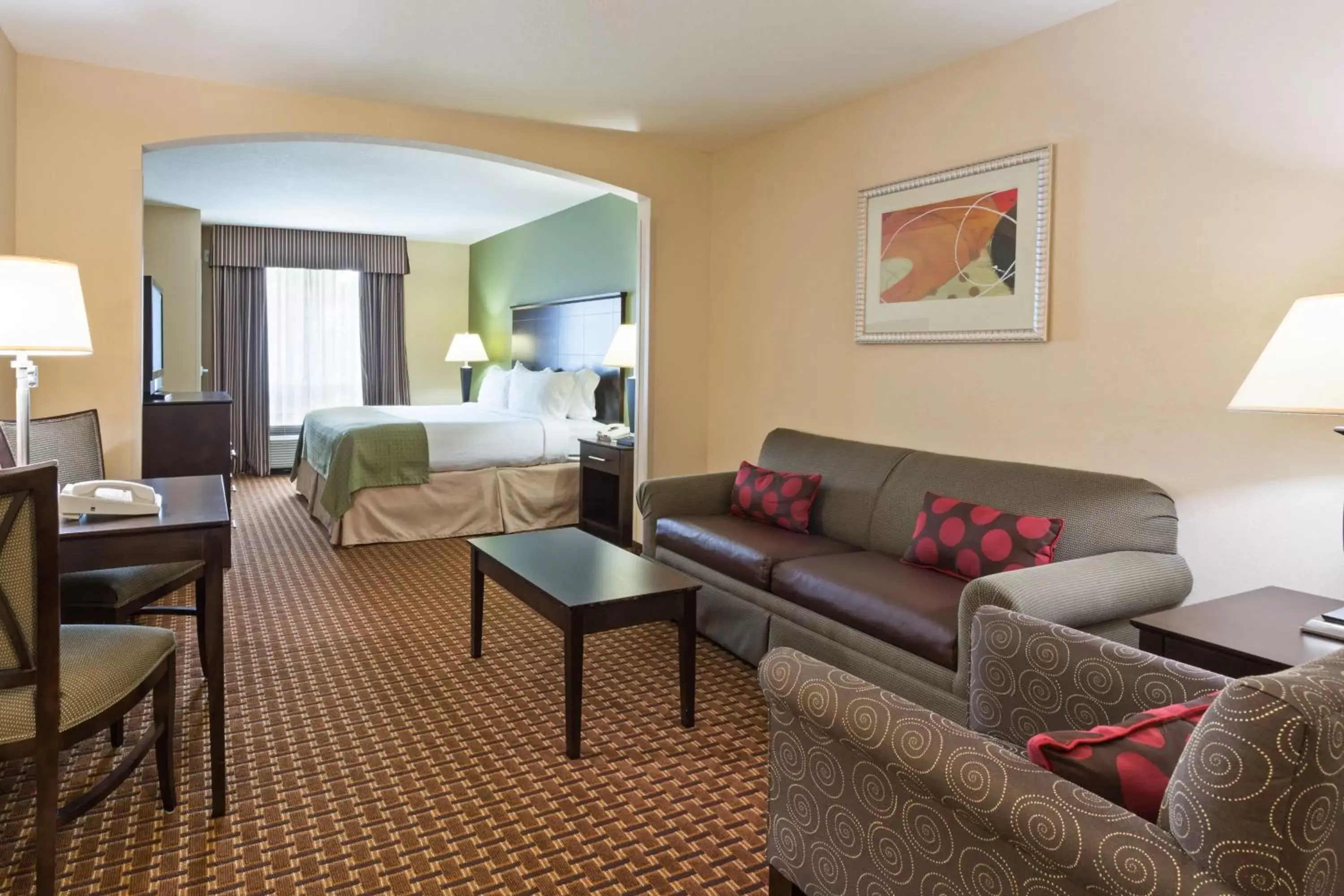Bedroom, Seating Area in Holiday Inn Daytona Beach LPGA Boulevard, an IHG Hotel