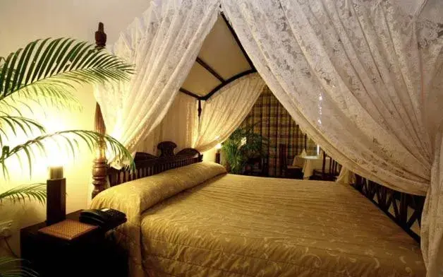 Bed in Grand Oriental Hotel
