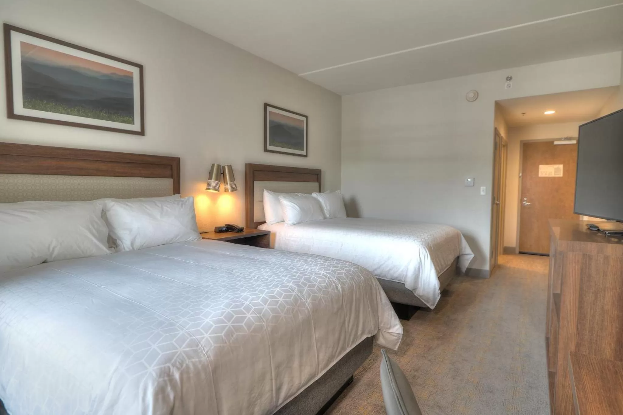 Photo of the whole room, Bed in Holiday Inn & Suites Pigeon Forge Convention Center by IHG