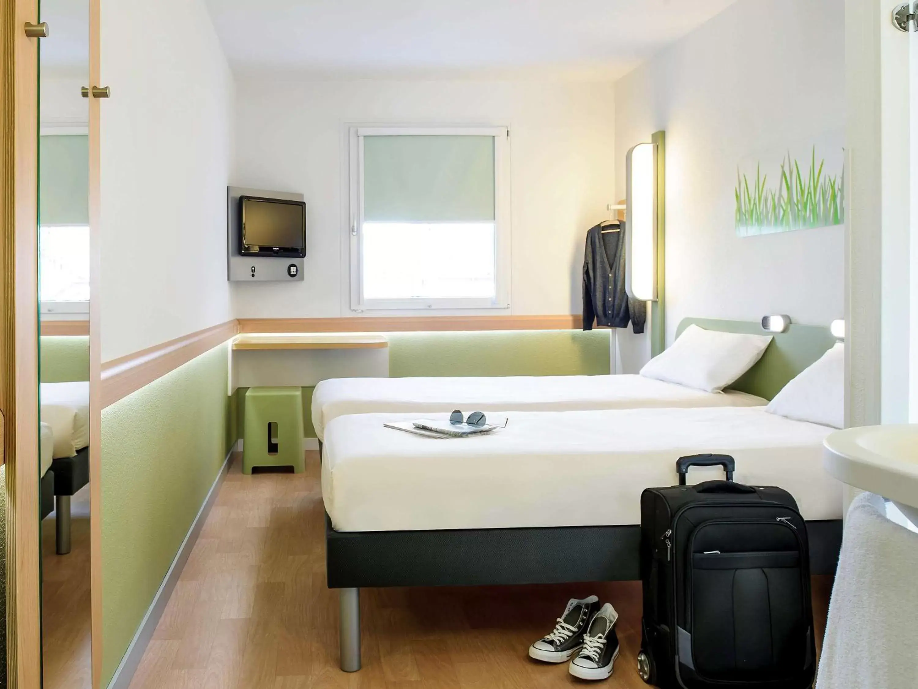 Photo of the whole room, Bed in Hotel Ibis Budget Lyon Eurexpo -