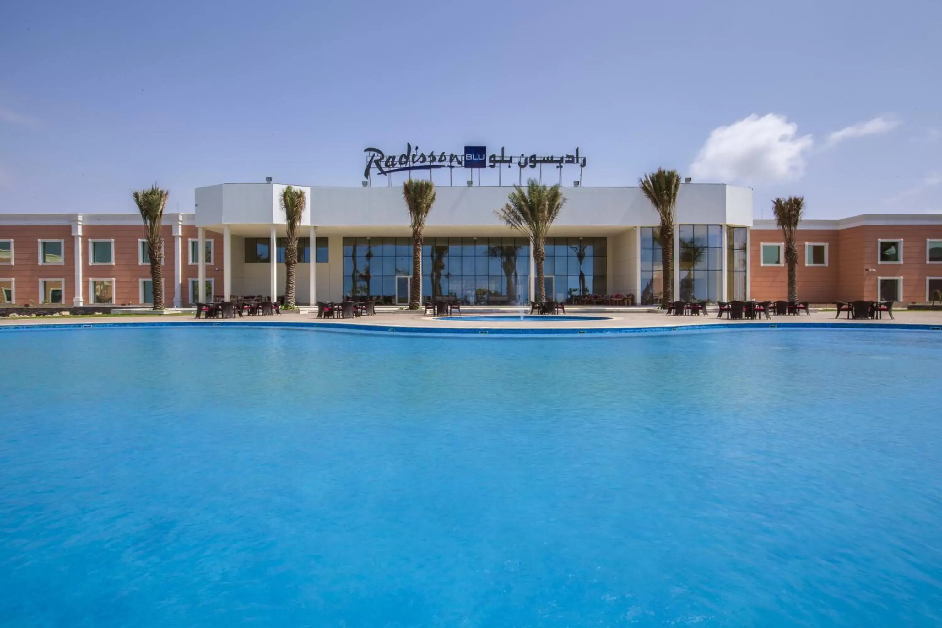 Swimming pool, Property Building in Radisson Blu Resort Jizan