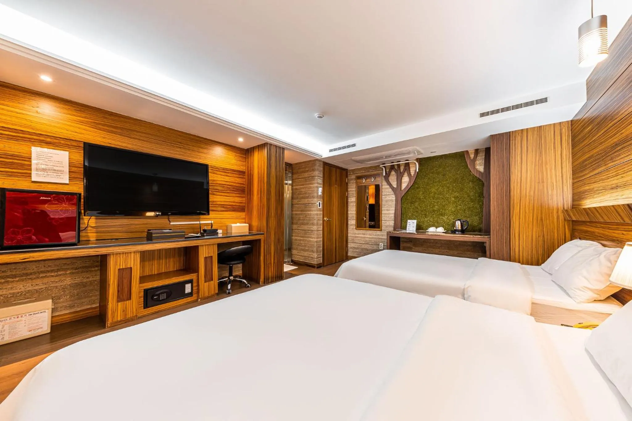 Bed in Friendly DH Naissance Hotel by Mindrum Group