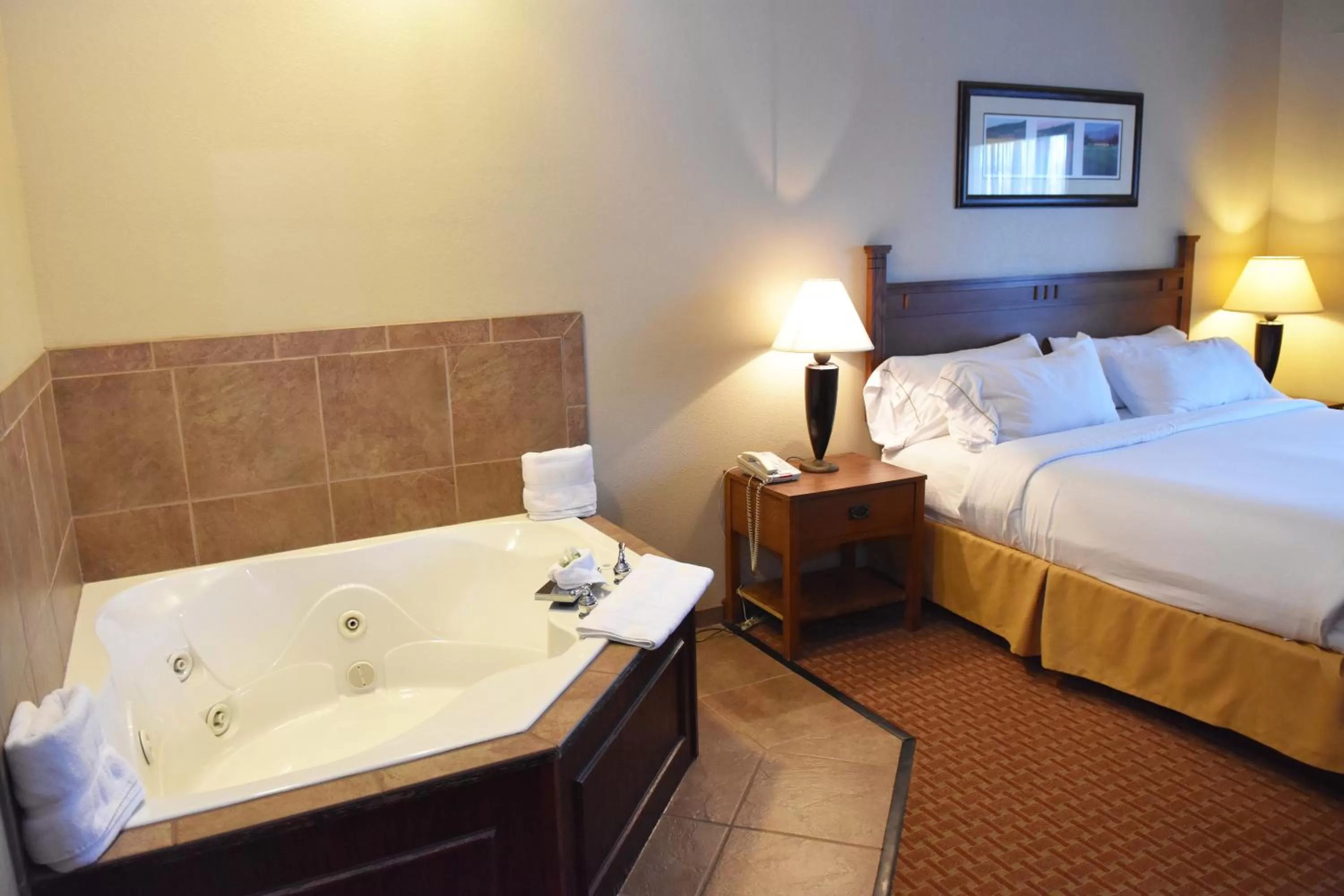 Bed in Baymont Inn & Suites by Wyndham Sturgis