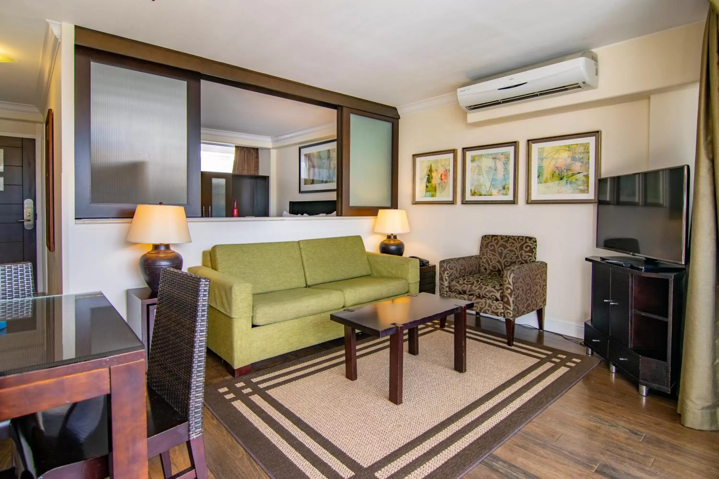 Living room, Seating Area in Regency on Beachwalk Waikiki by OUTRIGGER