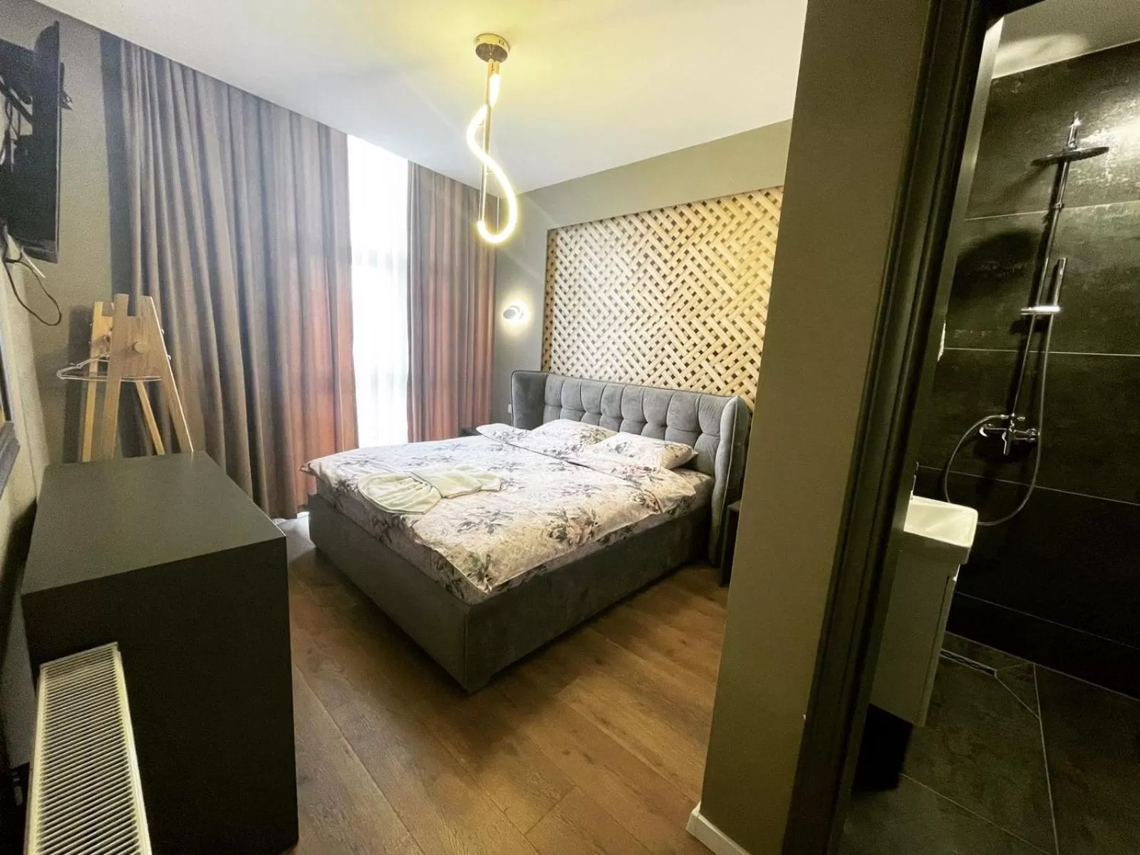 Bed in GRAND JNK Boutique Hotel