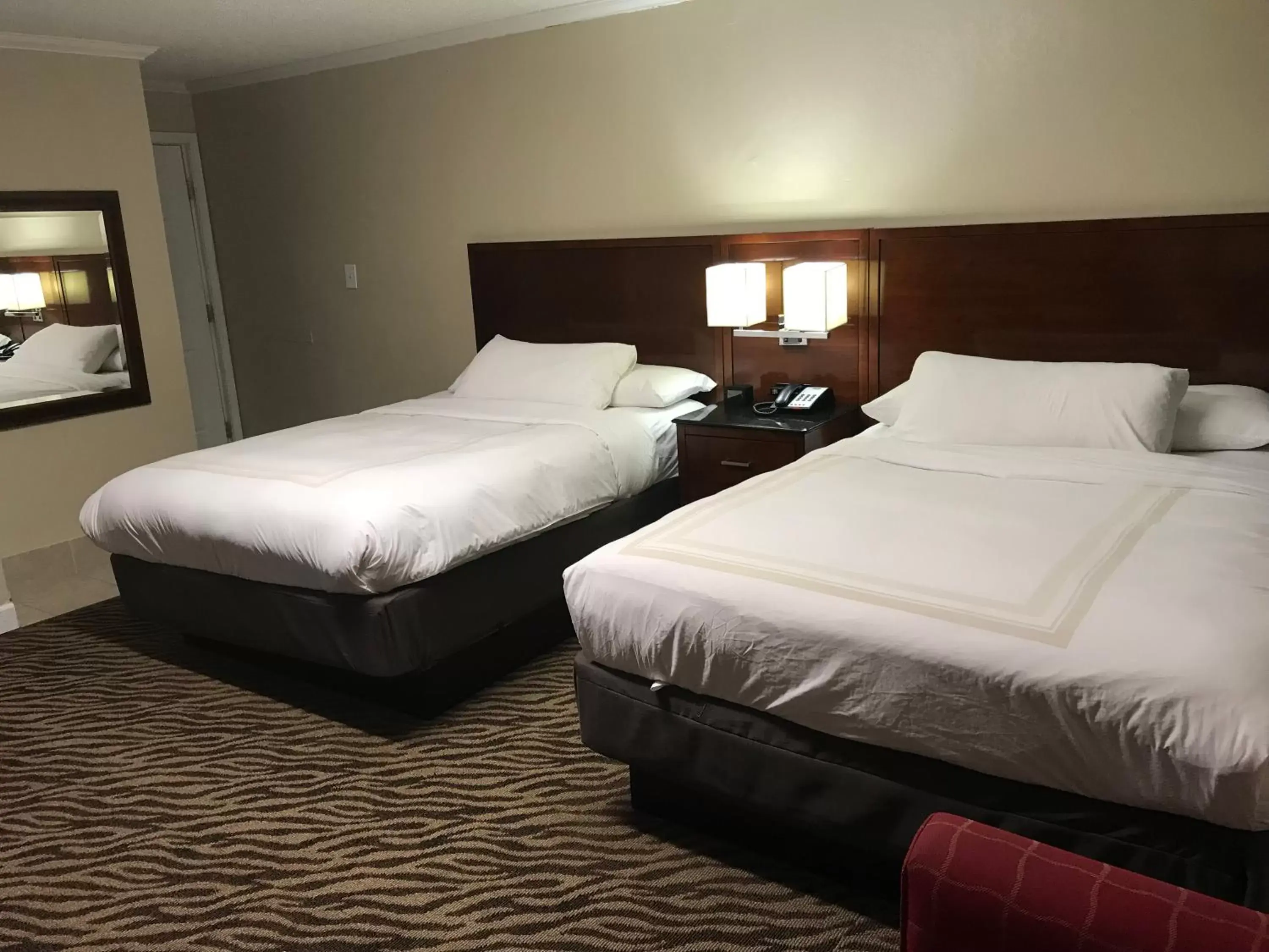 Bed in Hometown Inn & Suites