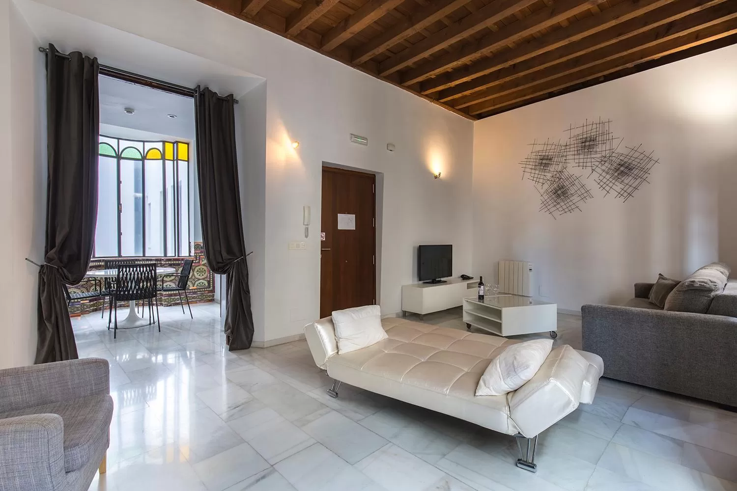 Seating area in tuGuest Elvira Suites