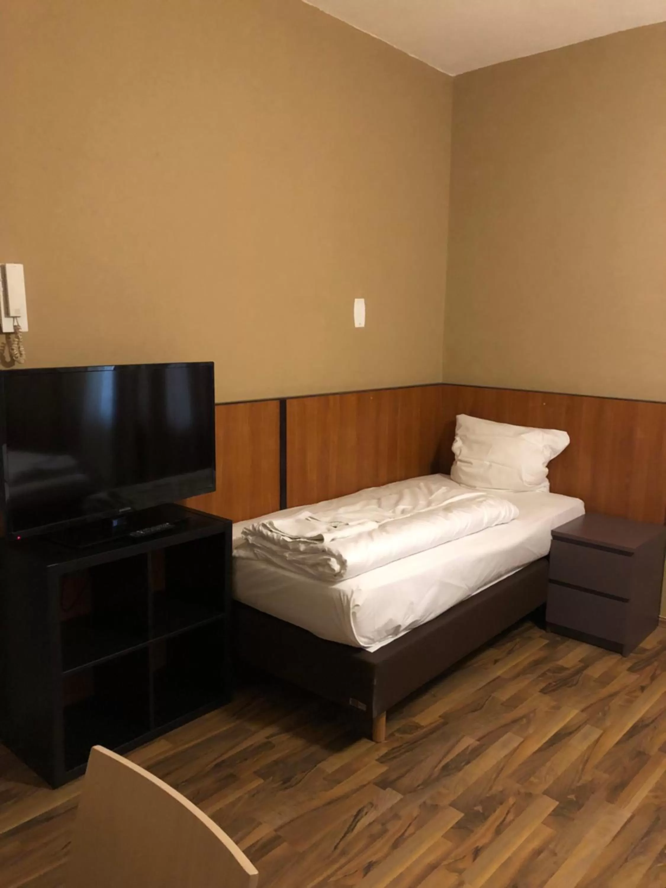 Bed in Hotel Poseidon