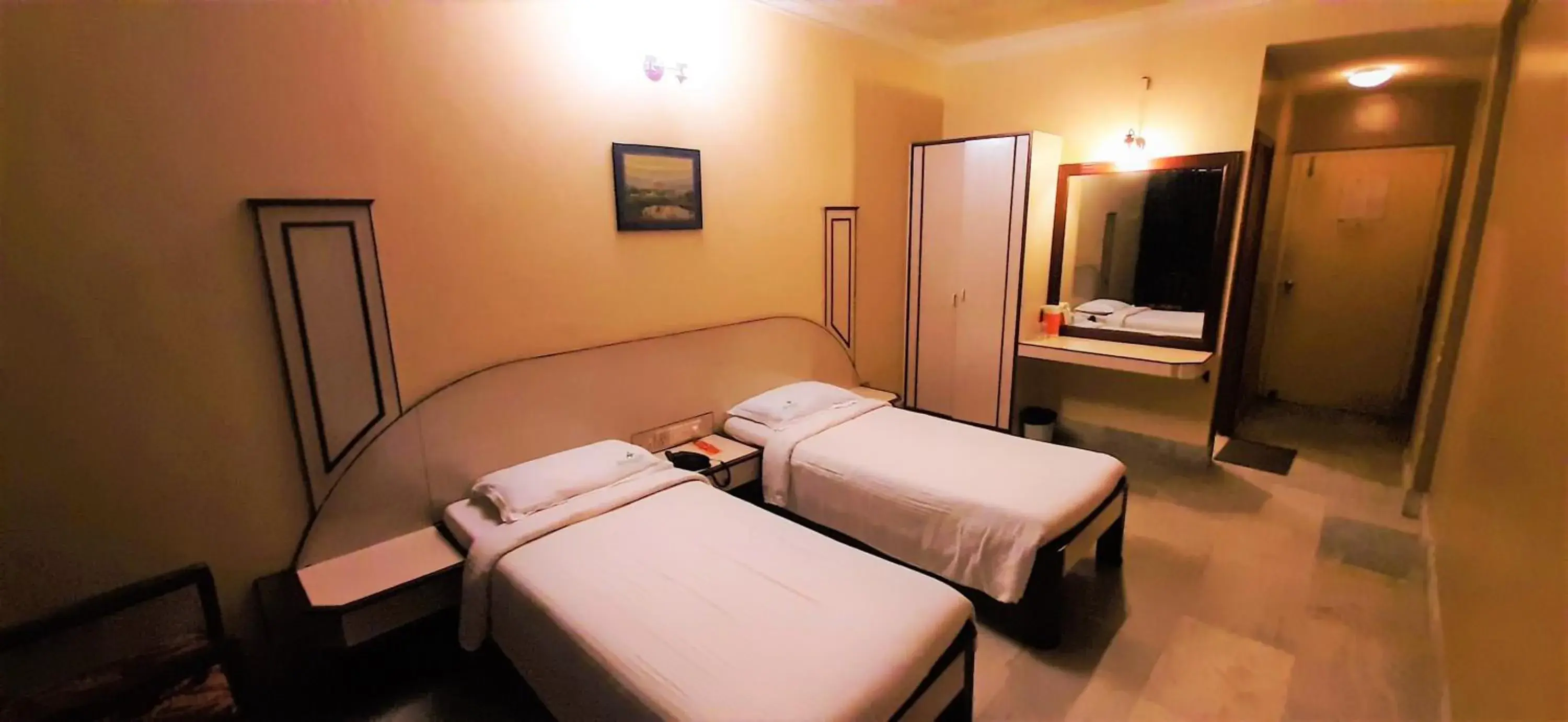 Photo of the whole room, Bed in Hotel Mangalore International