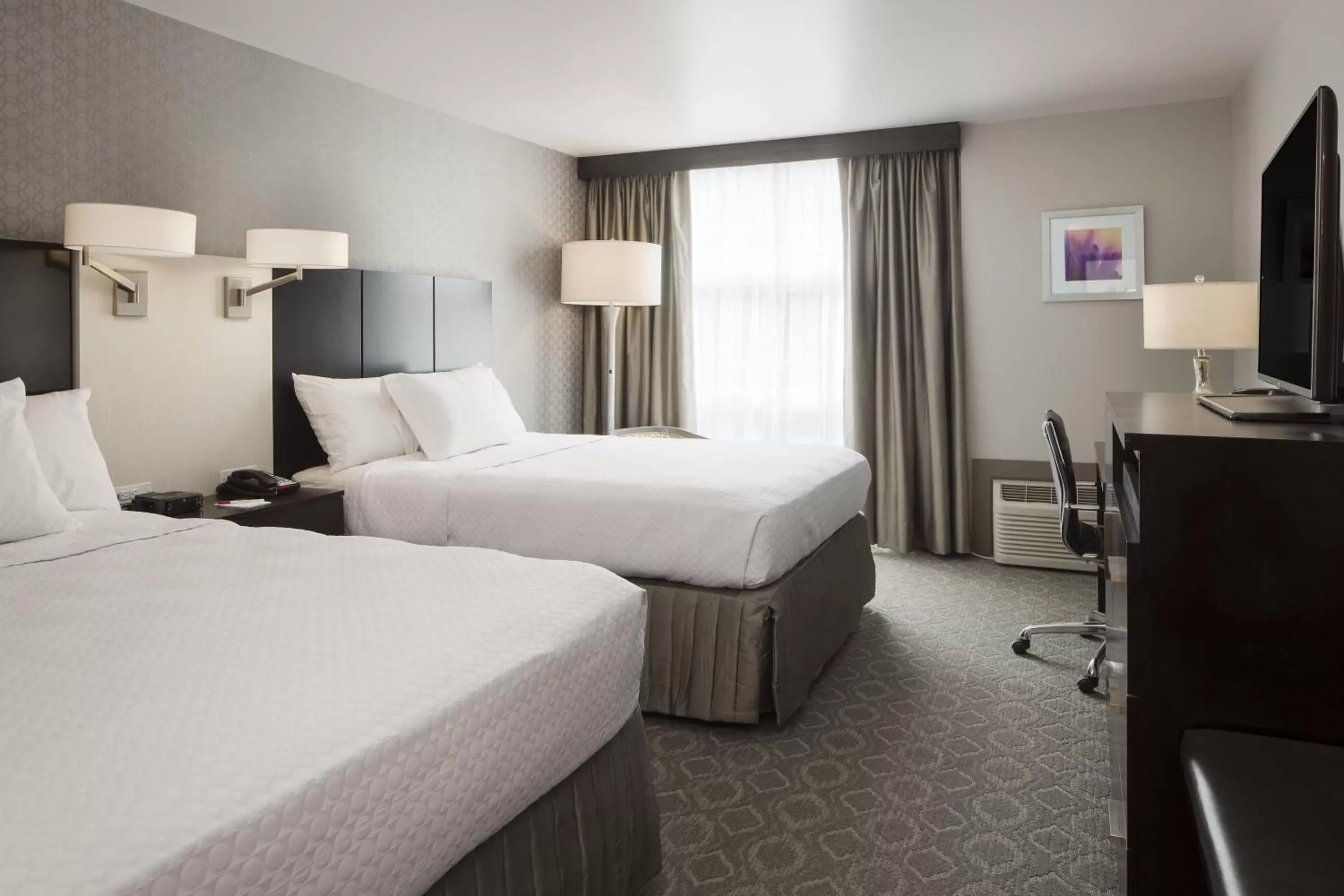 Photo of the whole room, Bed in Crowne Plaza Chicago SW - Burr Ridge, an IHG Hotel