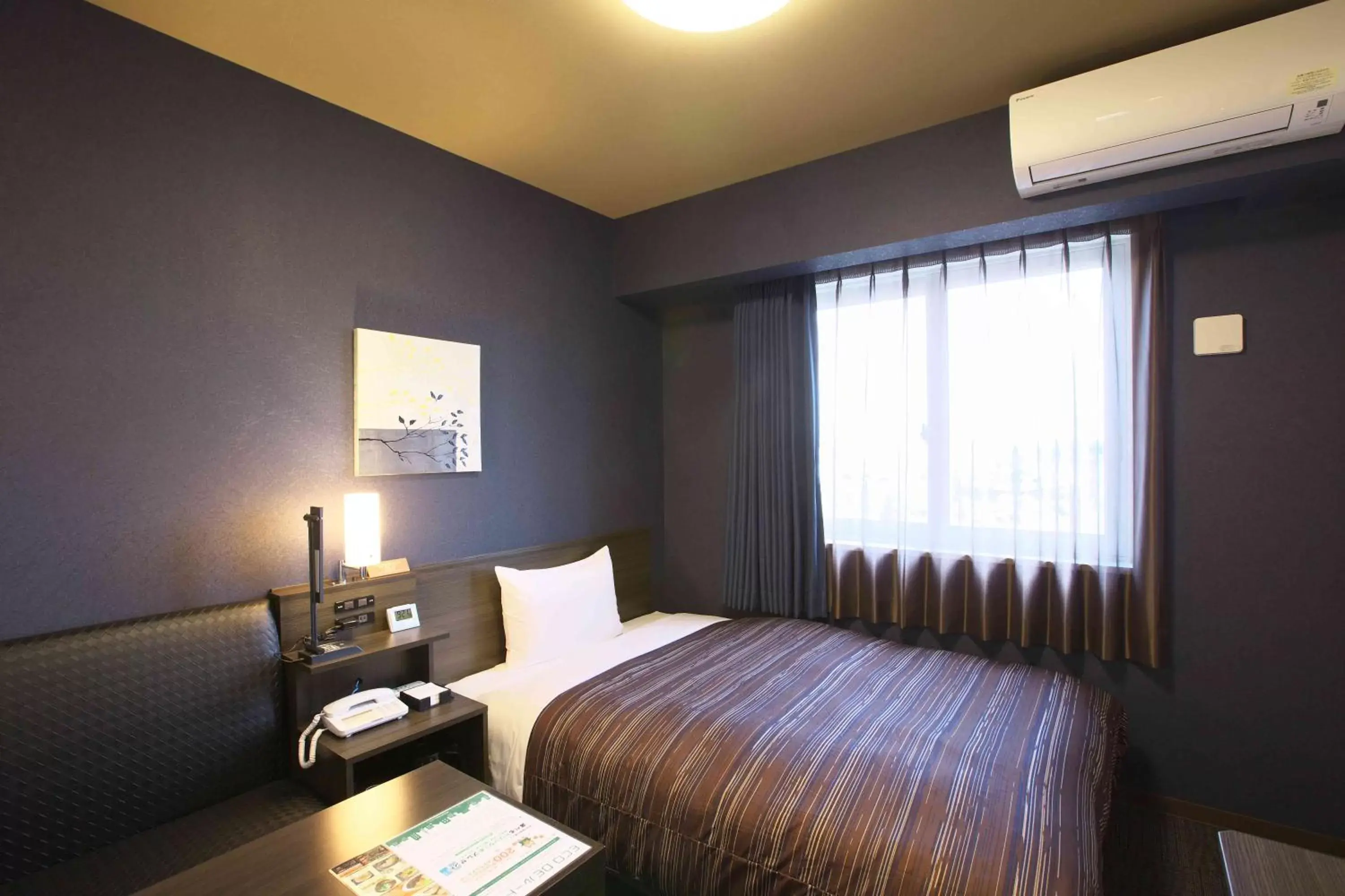 Bed in Hotel Route Inn Osaka Izumi -Kishiwada Izumi Inter-