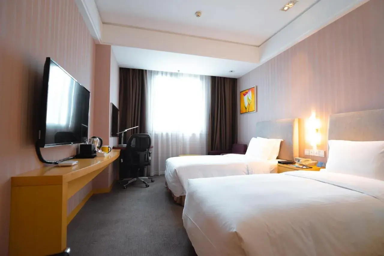 Bed in Holiday Inn Express Nantong Xinghu, an IHG Hotel