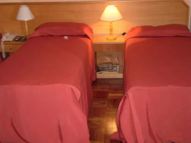 Bed in Hotel Gravataí Center