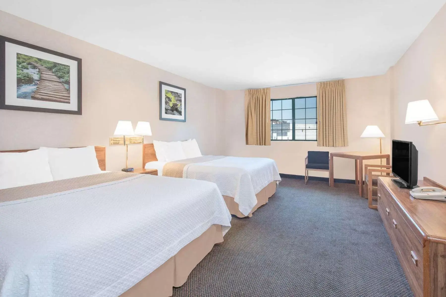 Photo of the whole room, Bed in Days Inn by Wyndham West Rapid City