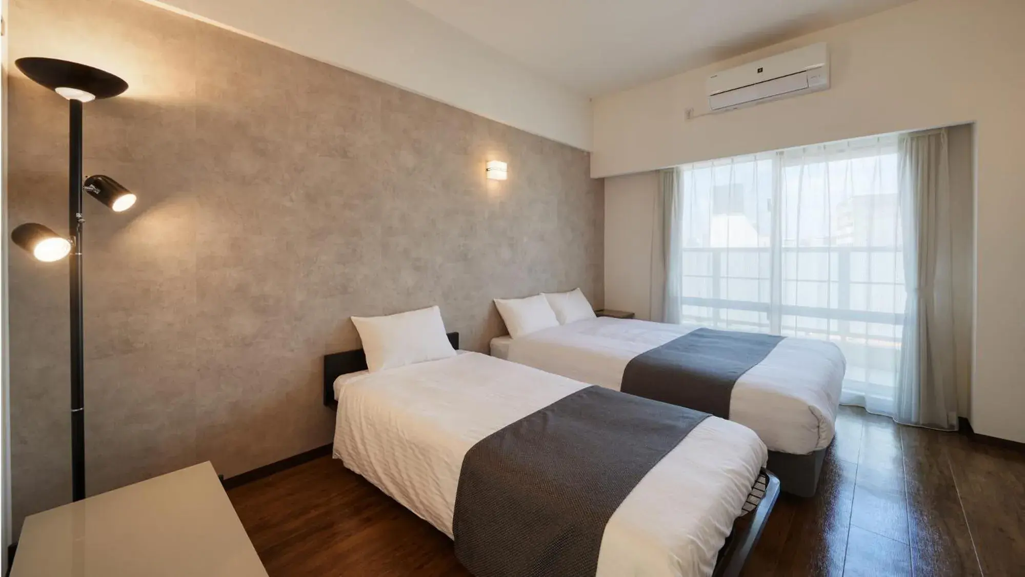 Photo of the whole room, Bed in New Normal Hotel in NAMINOUE