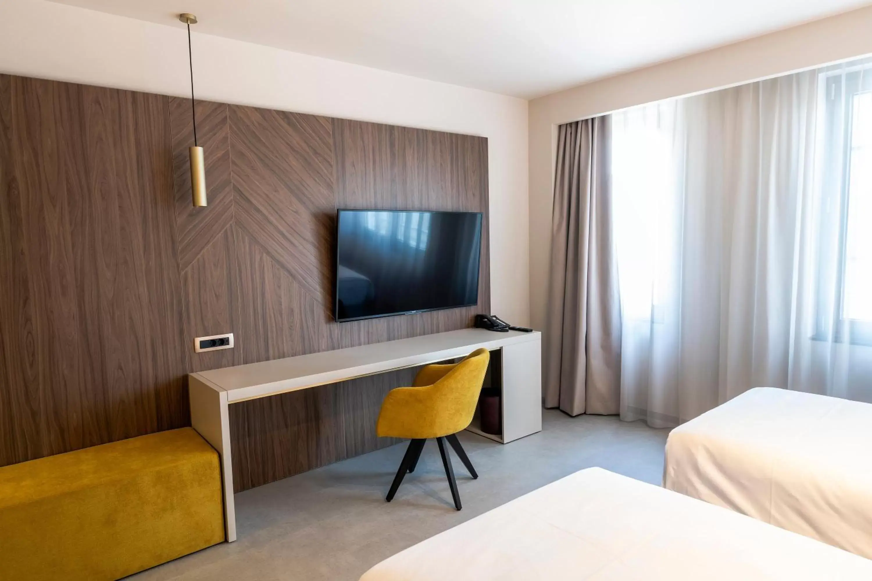 Photo of the whole room, TV/Entertainment Center in Austria Trend Hotel Ljubljana