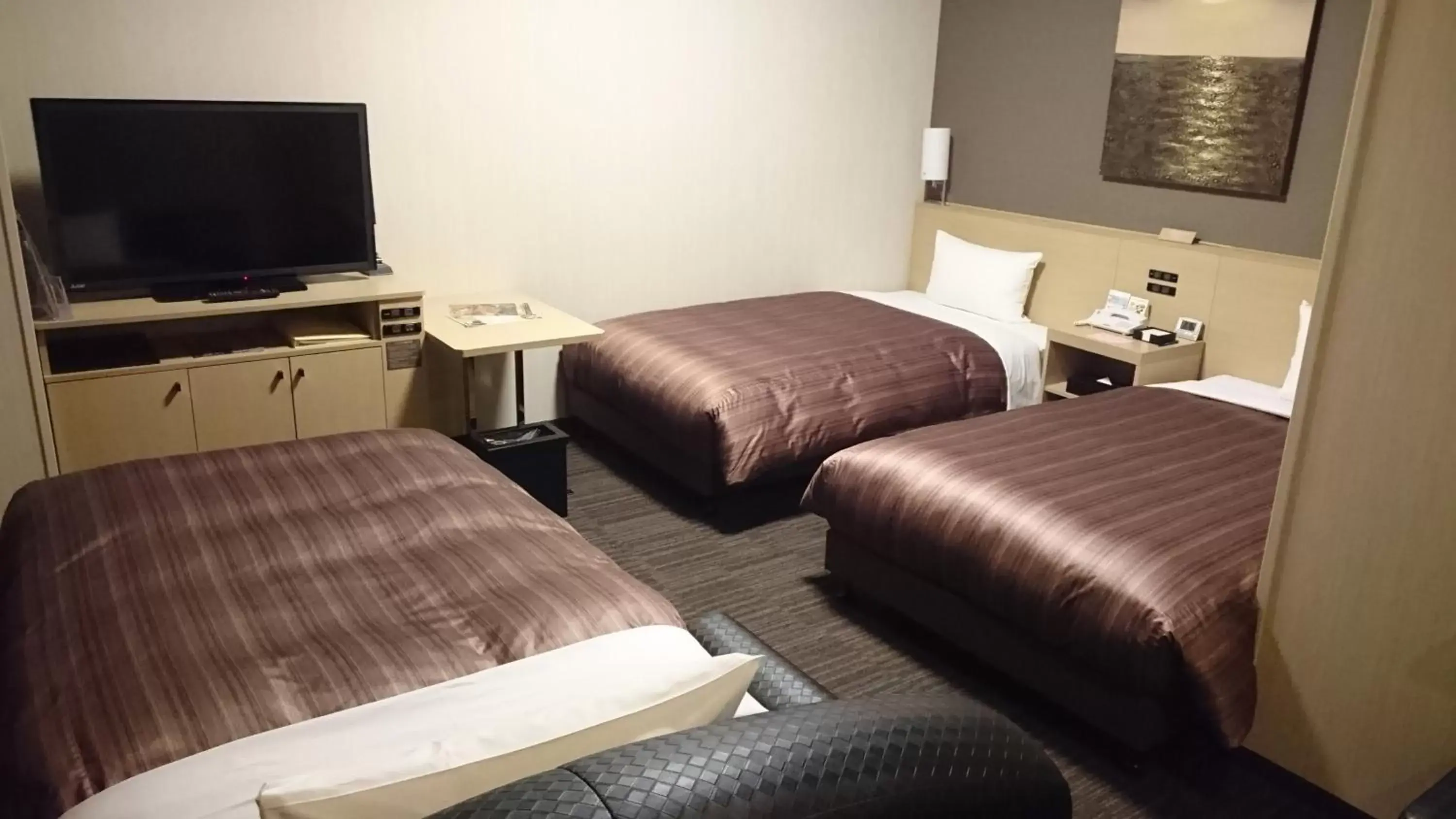 Bed in Hotel Route Inn Grand Asahikawa Ekimae