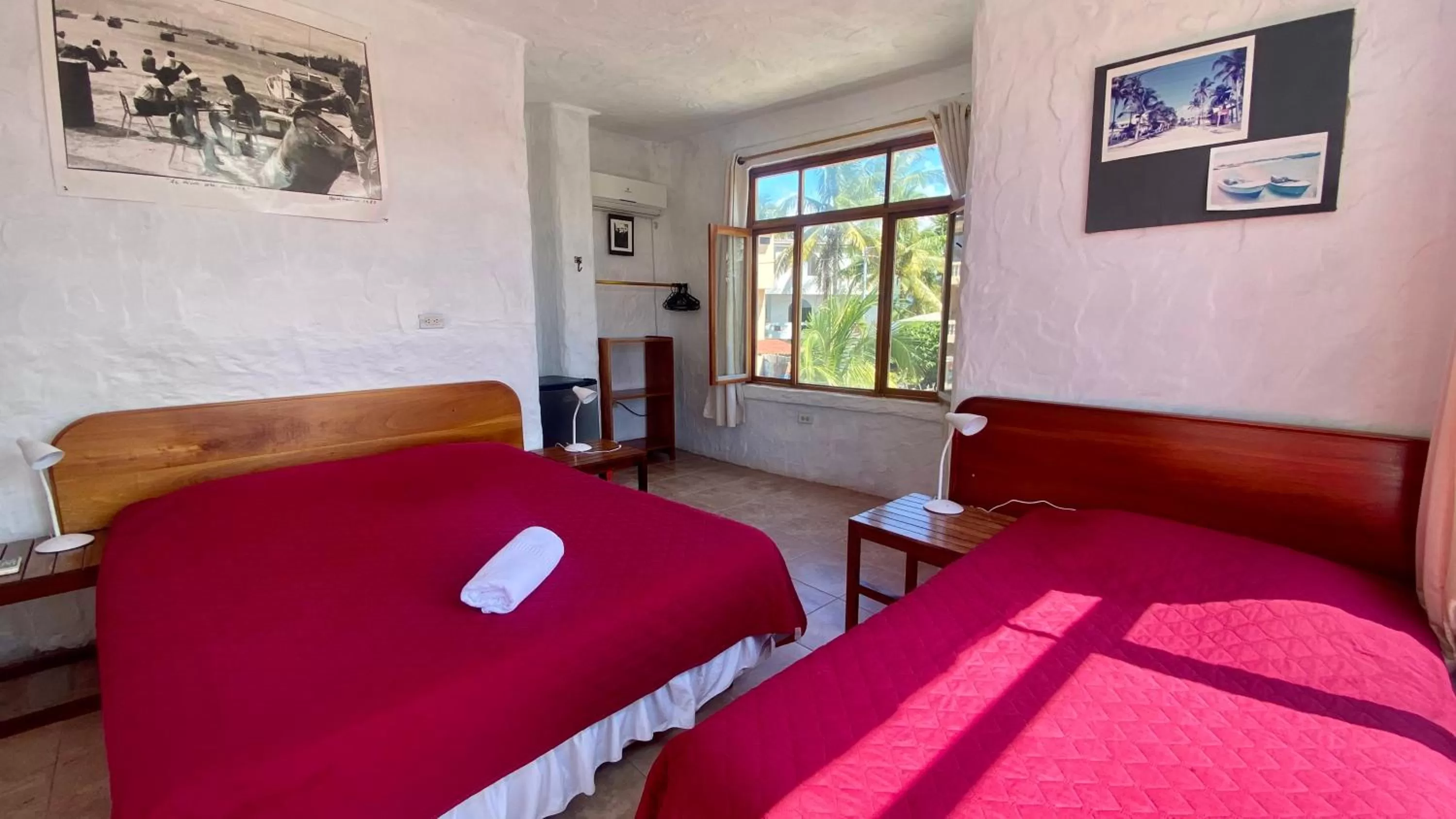 Bed in Hostal Galapagos by Bar de Beto