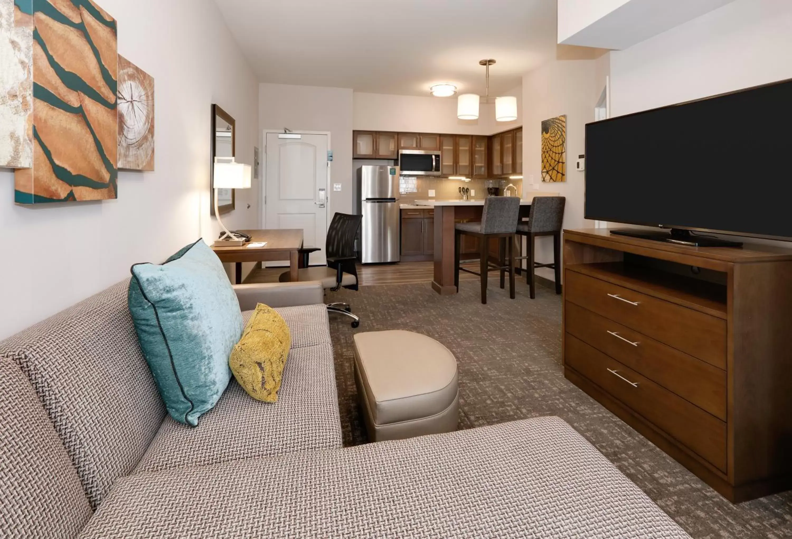 Bedroom, Seating Area in Staybridge Suites - Oklahoma City - Downtown, an IHG Hotel