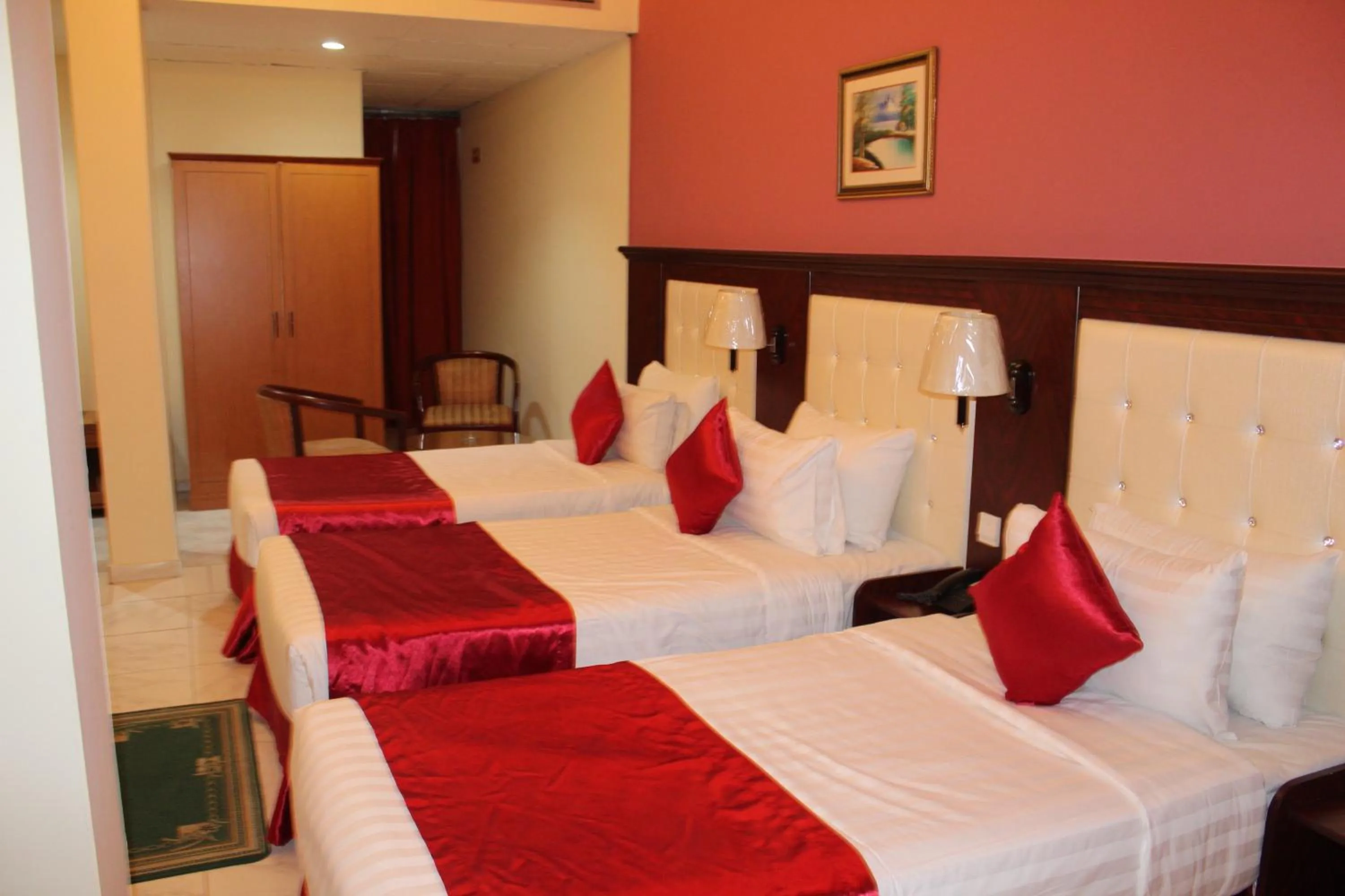 Bed in Grand Nova Hotel