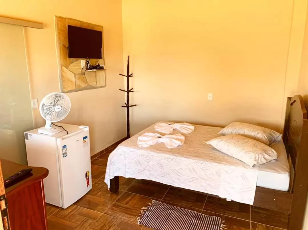 Bed in Pousada e Chales Por do Sol