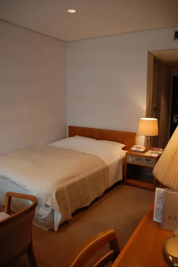 Bed in Kojima Puchi Hotel