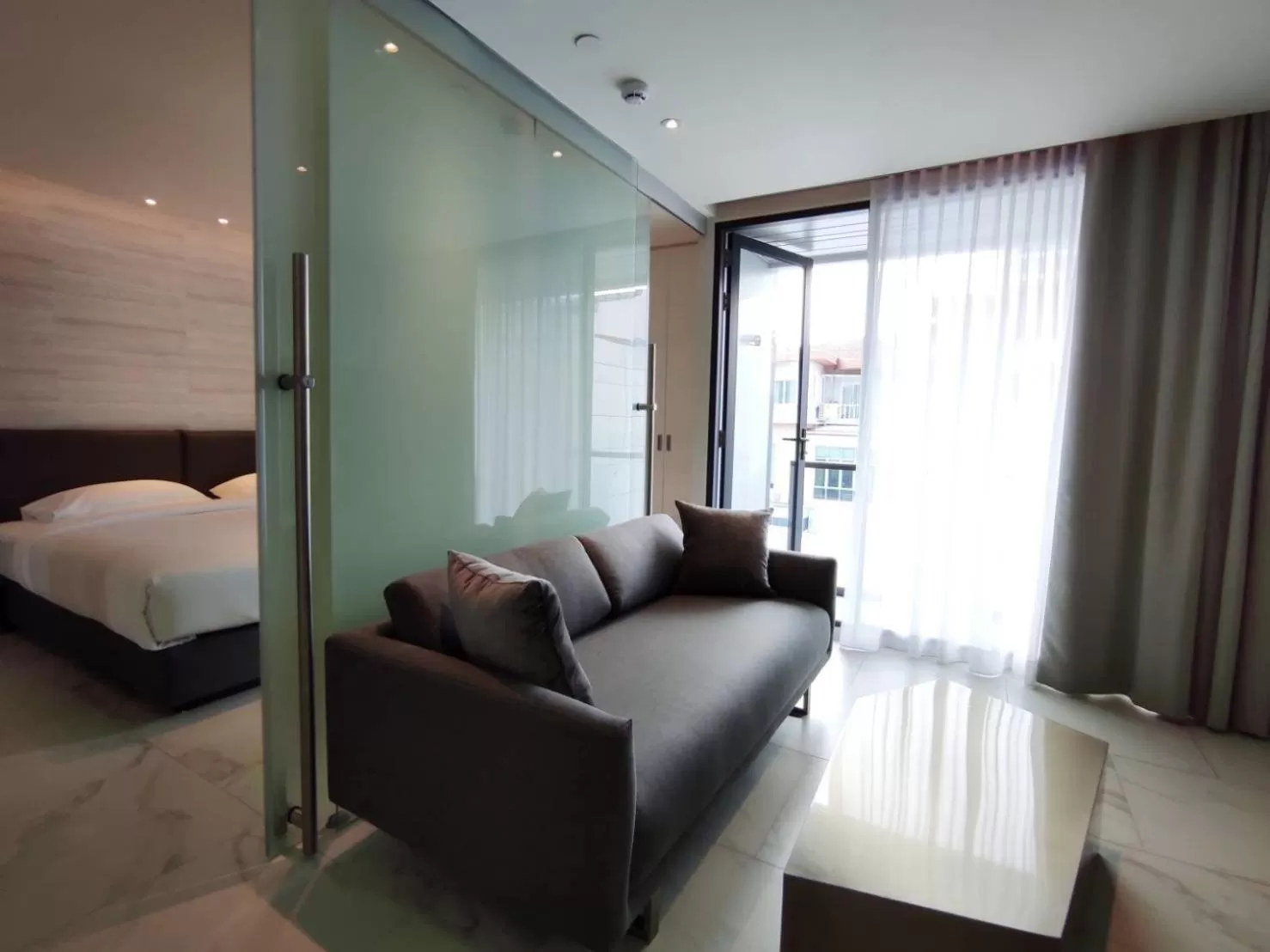 Living room, Bed in ashley hotel bkk