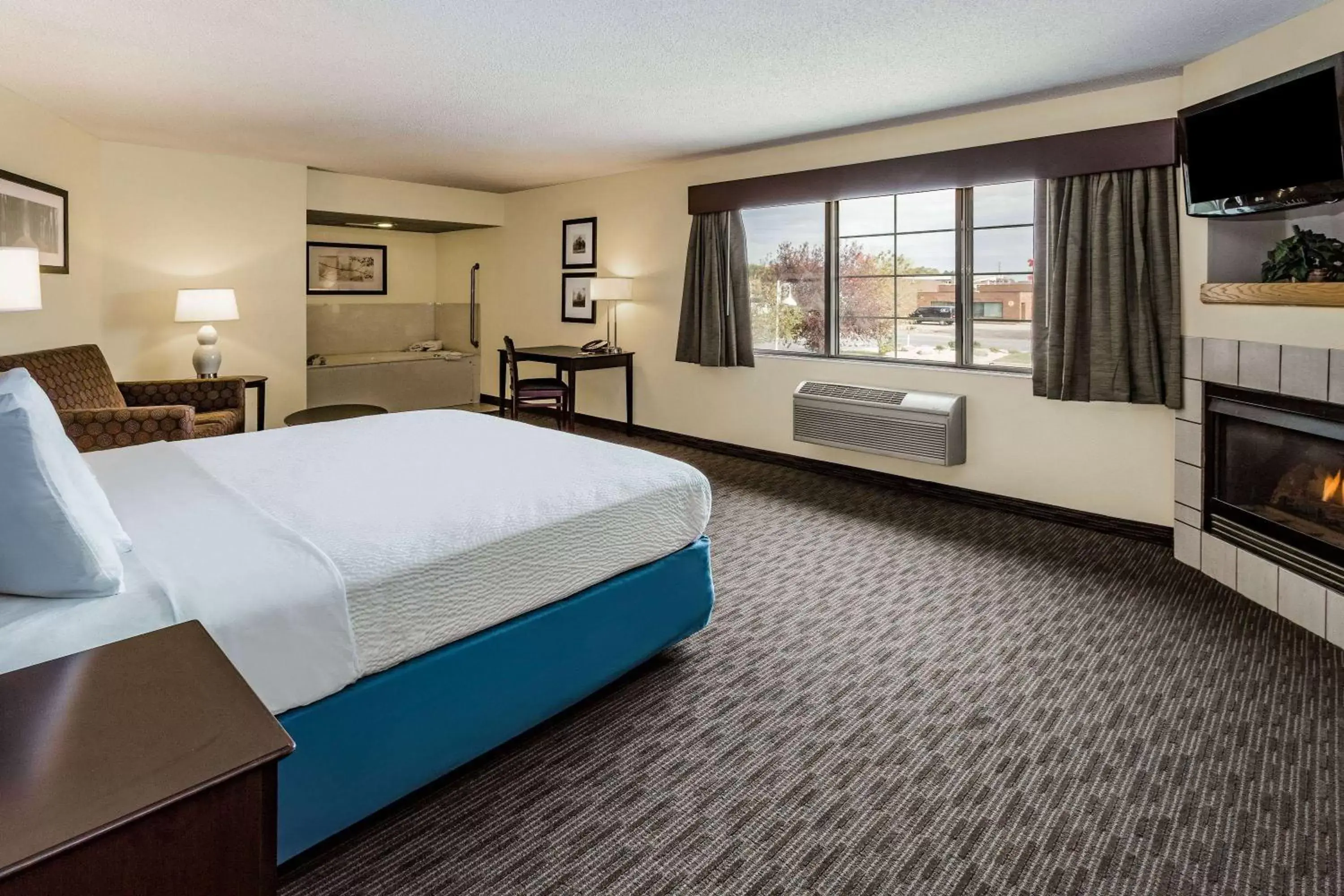 Photo of the whole room, Bed in AmericInn by Wyndham Hotel and Suites Long Lake