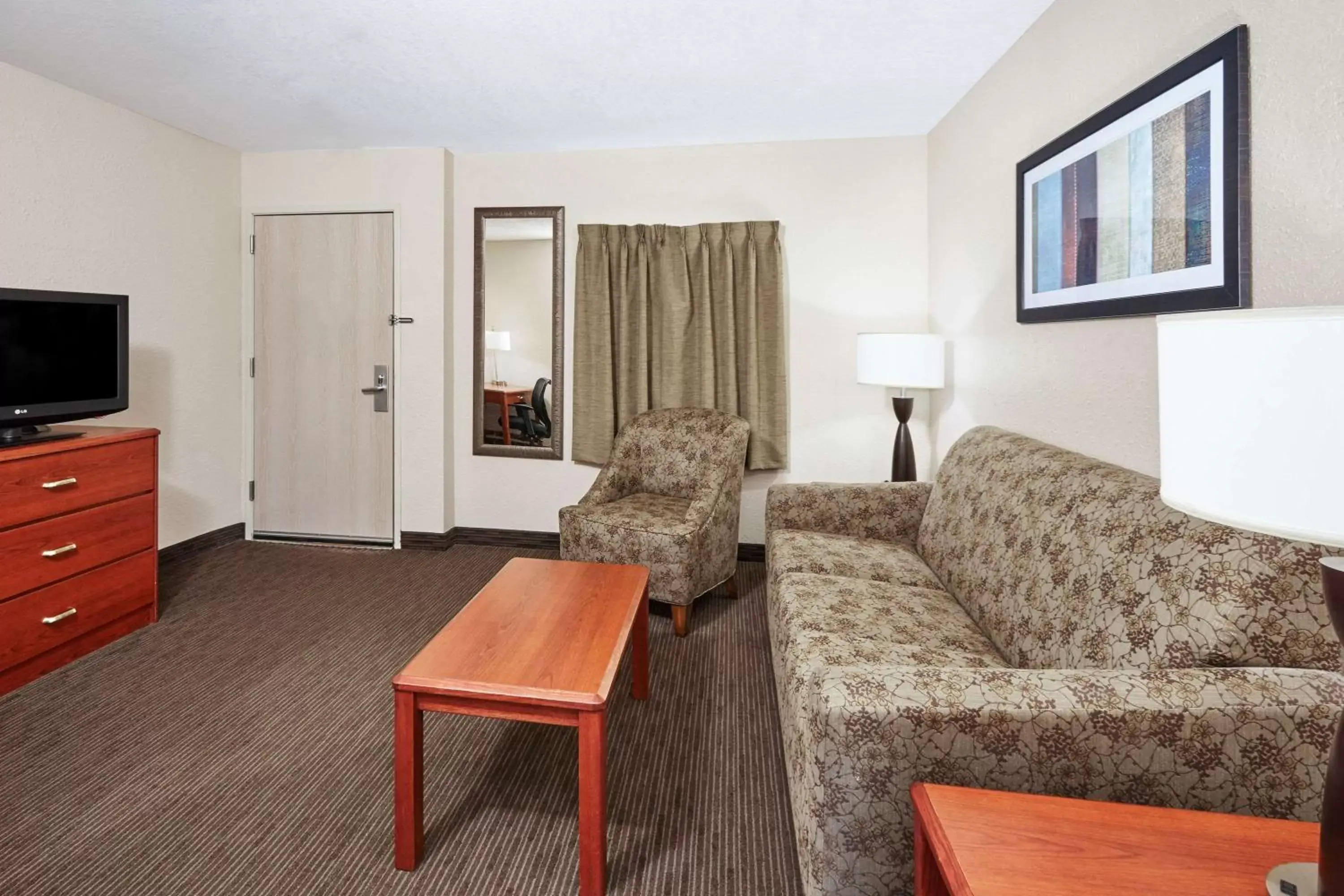 Living room, Seating Area in AmericInn by Wyndham Douglas/Saugatuck