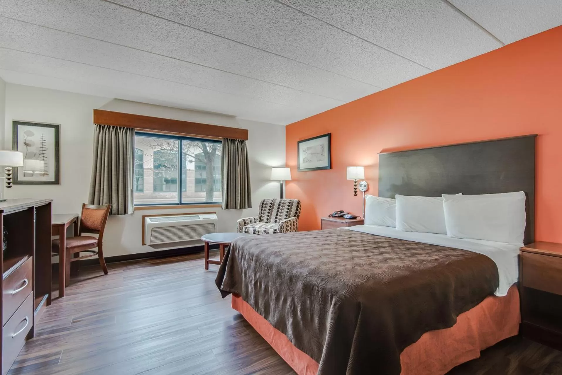 Bed in AmericInn by Wyndham Coon Rapids