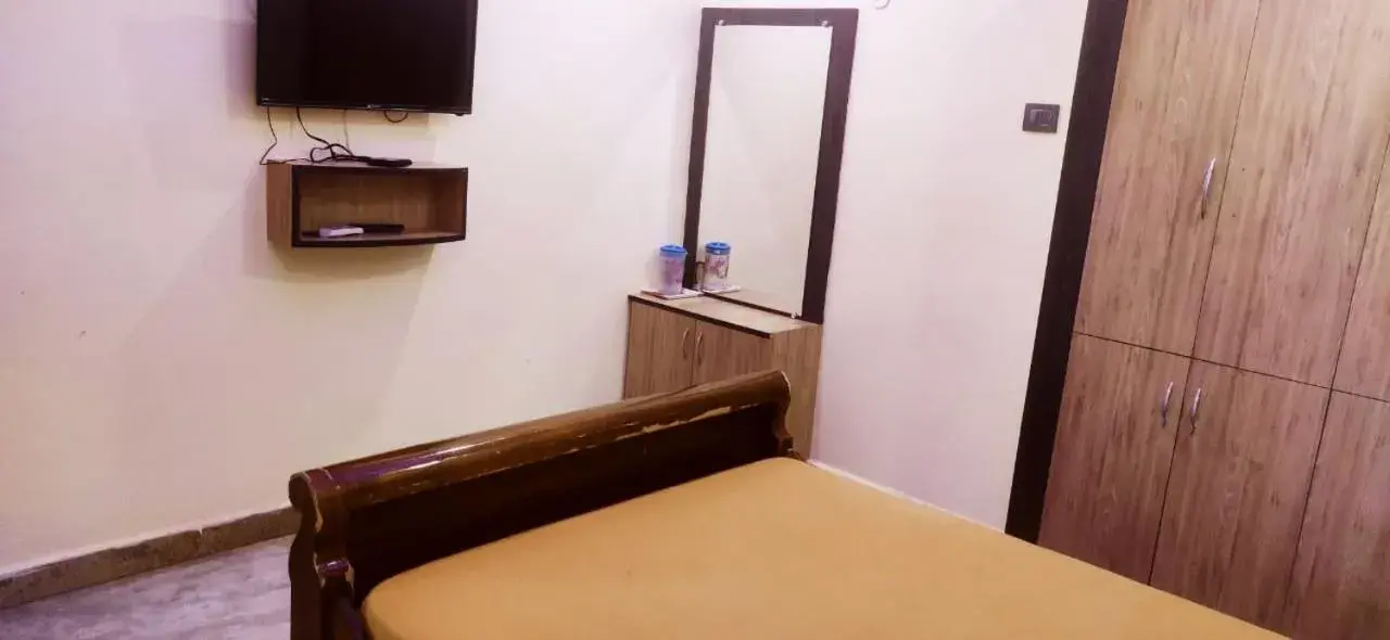 Bedroom, TV/Entertainment Center in sree kumaran residence