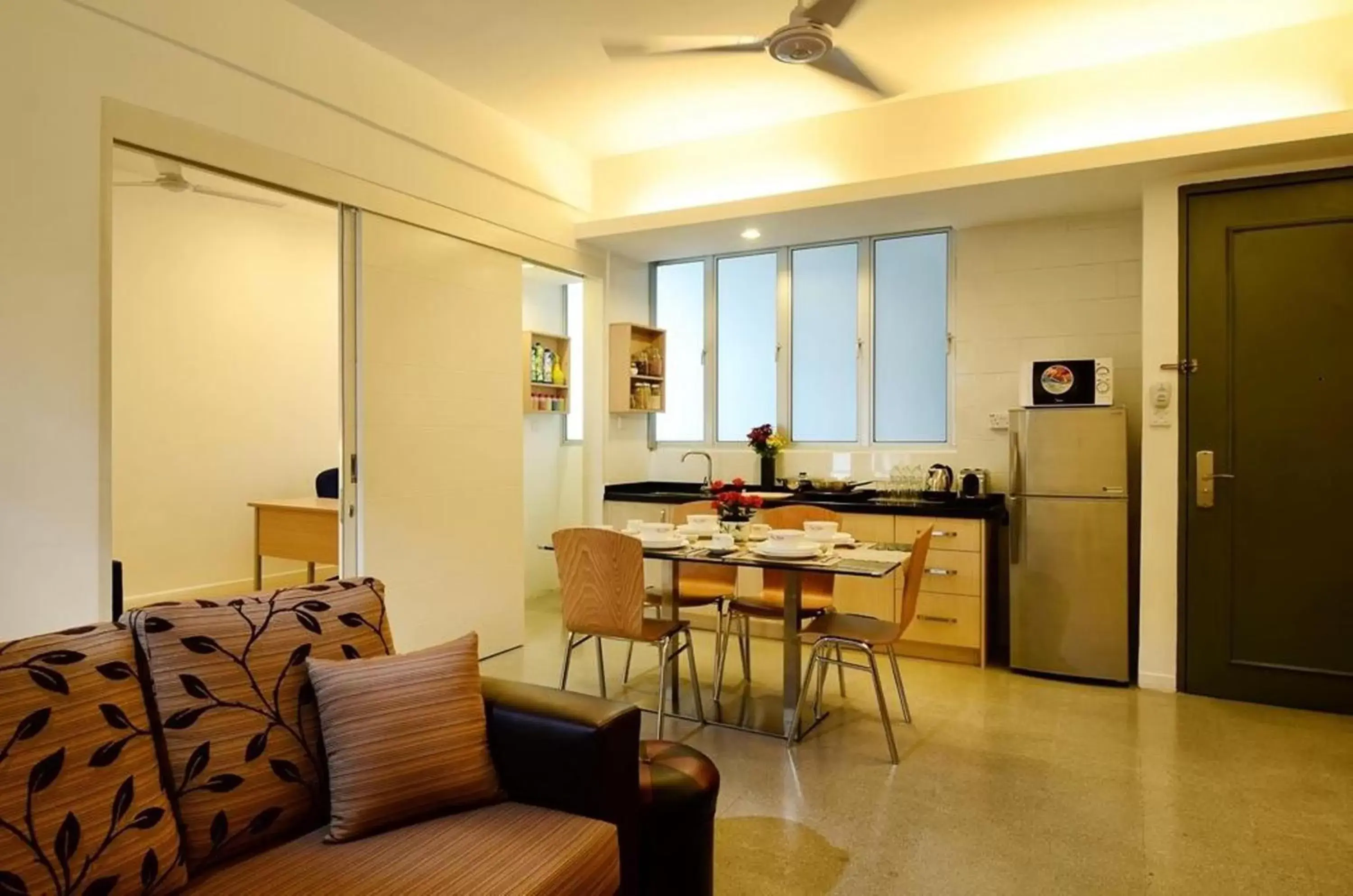 Kitchen or kitchenette, Dining Area in One-Stop Residence & Hotel