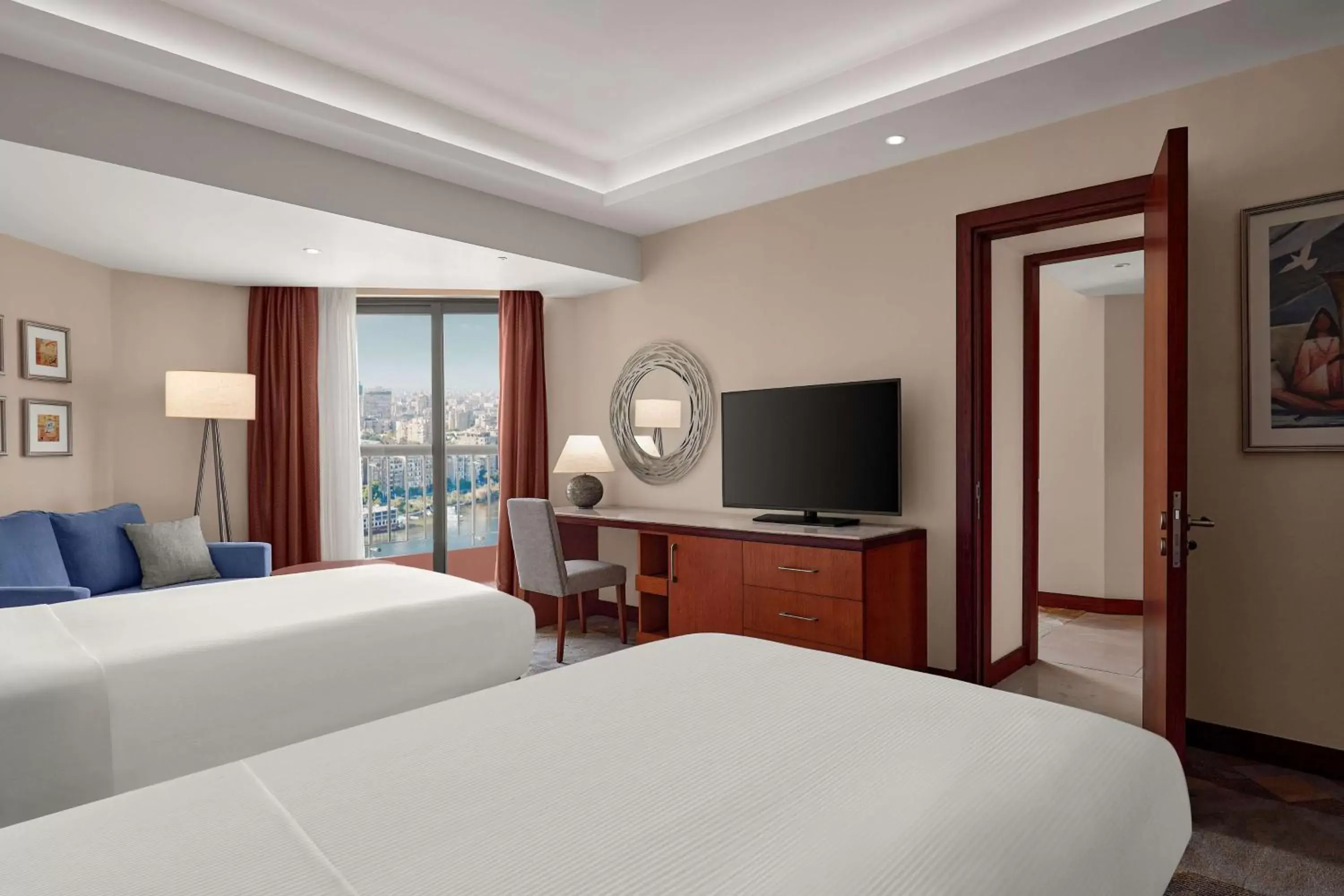 Bed, TV/Entertainment Center in Ramses Hilton Hotel & Casino