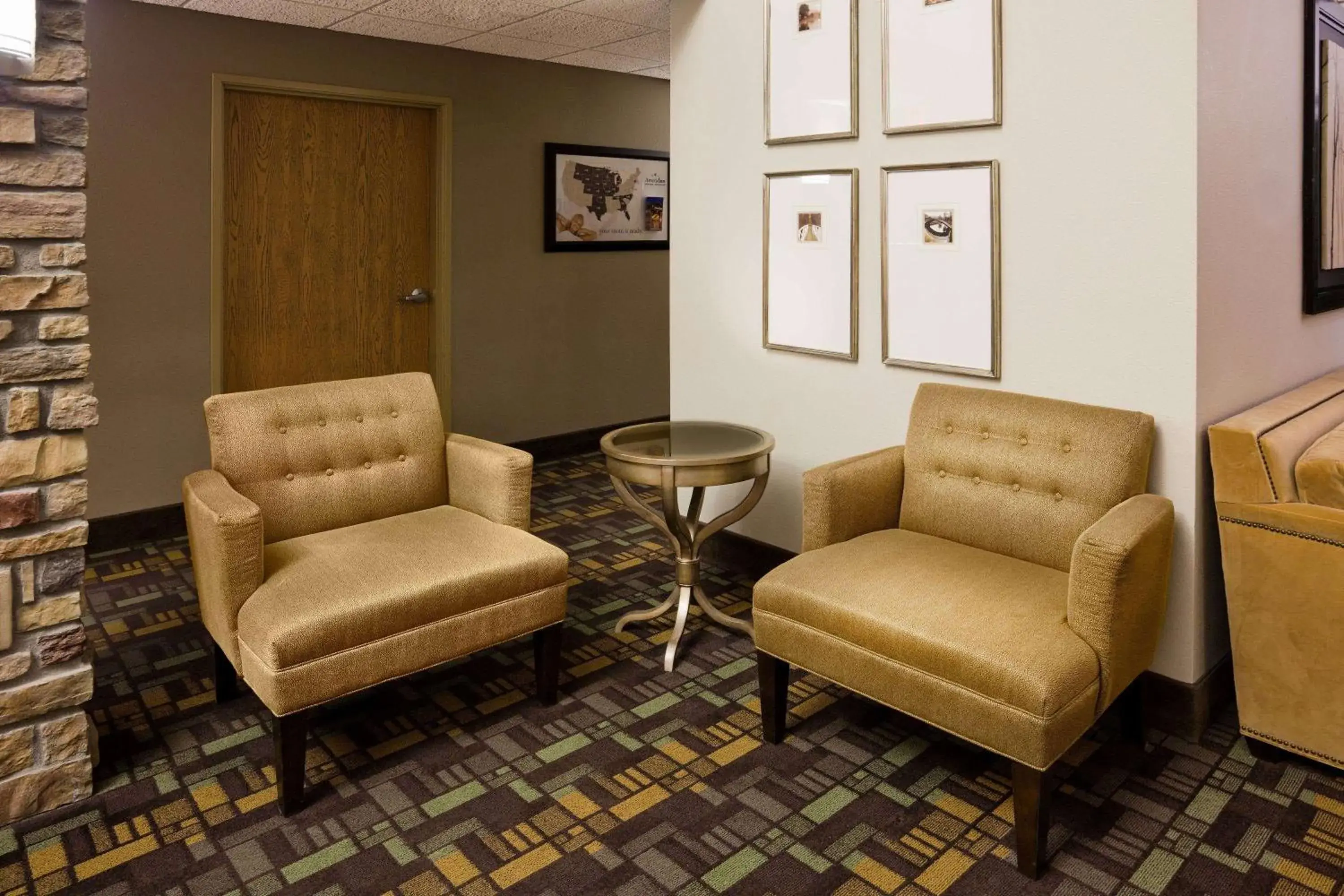 Seating Area in AmericInn by Wyndham Osage