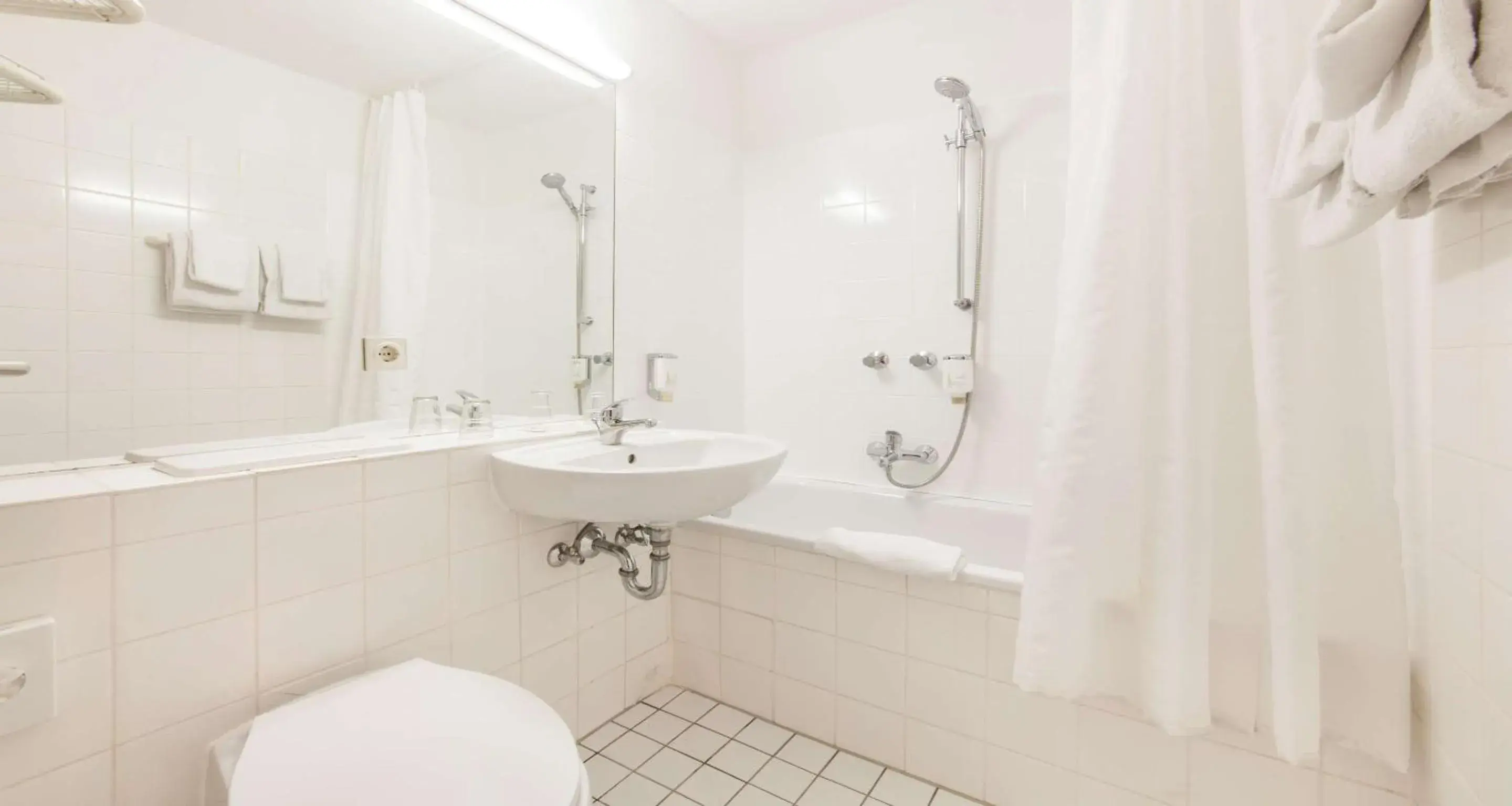 Photo of the whole room, Bathroom in Sure Hotel by Best Western Muenchen Hauptbahnhof