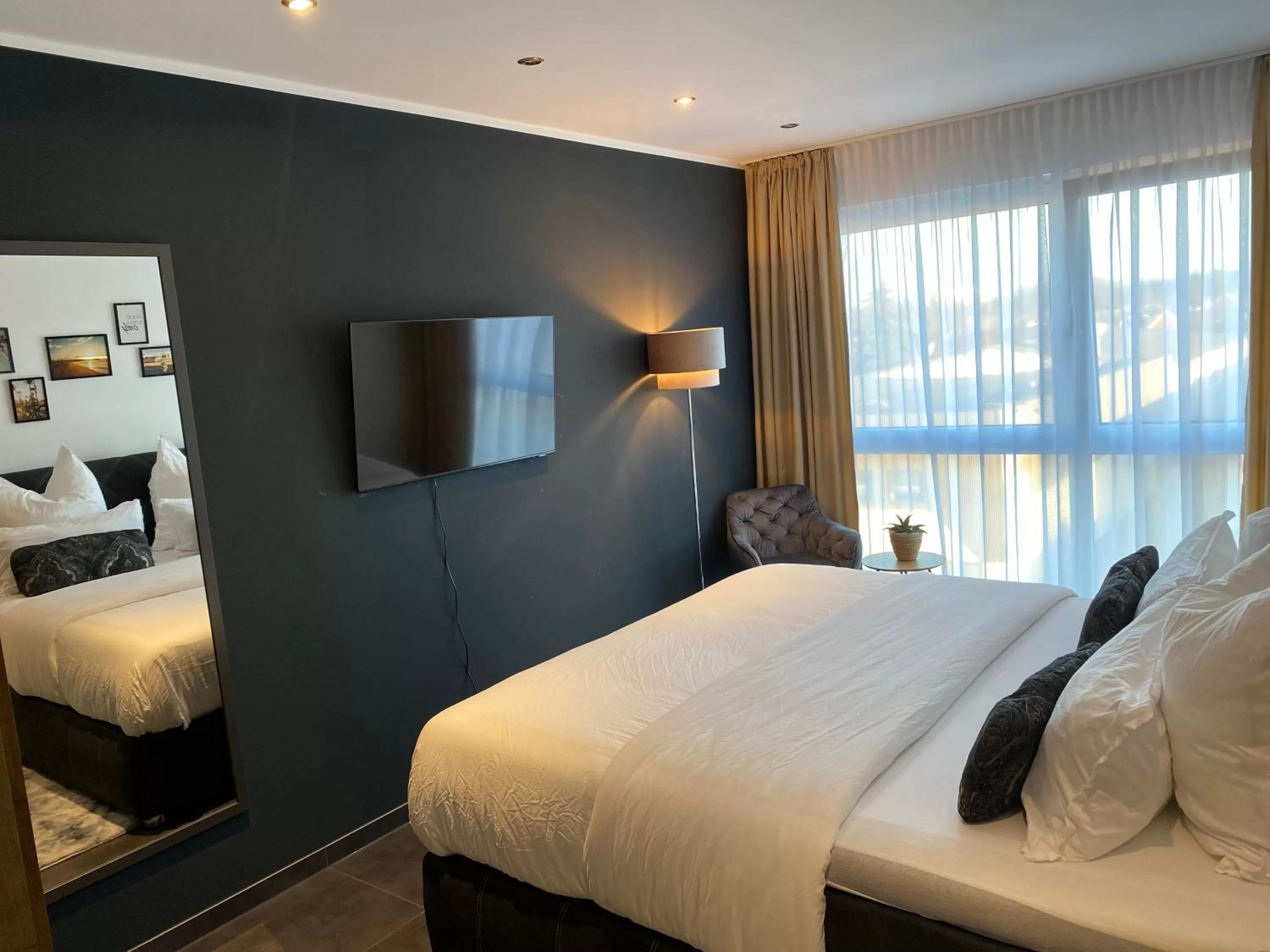 Bed in MARRAM Suitehotel