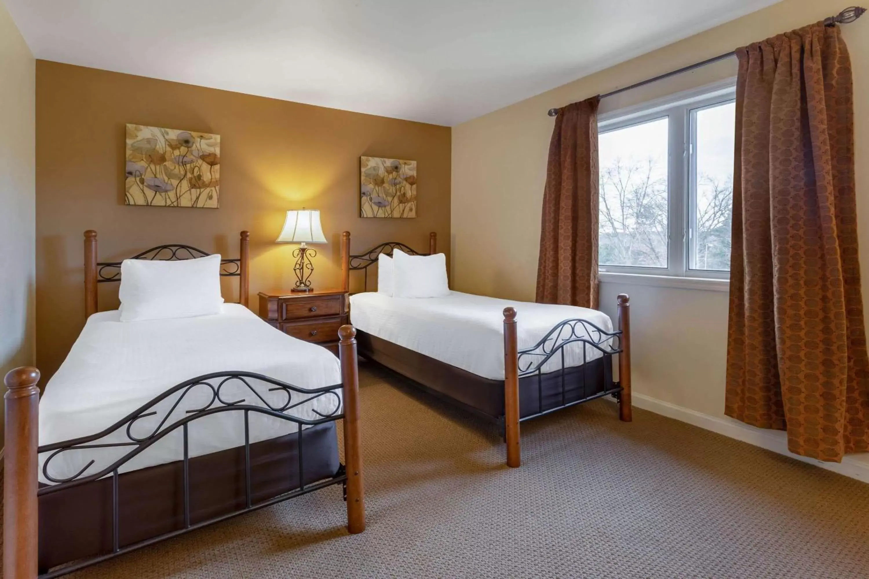 Bed in Tamarack Wisconsin Dells, a Ramada by Wyndham