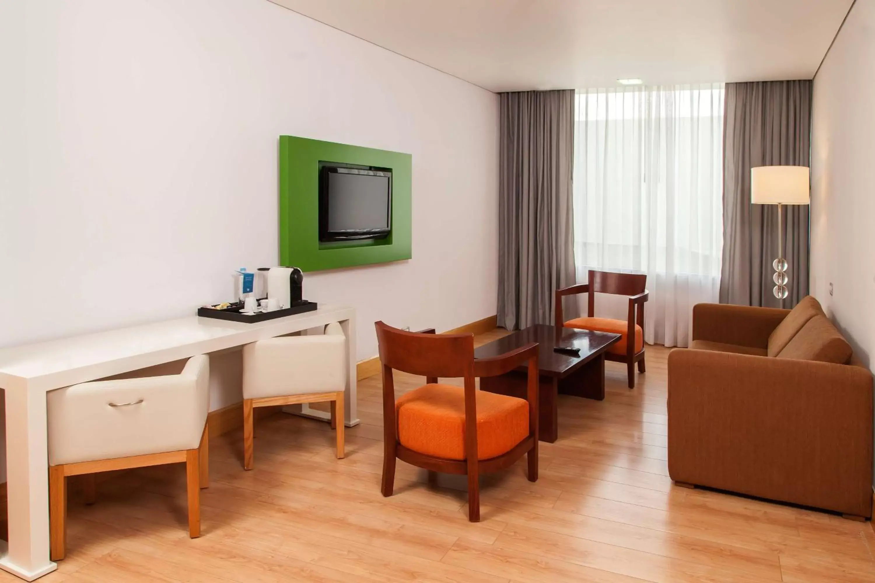 Photo of the whole room, TV/Entertainment Center in NH Collection Mexico City Airport T2