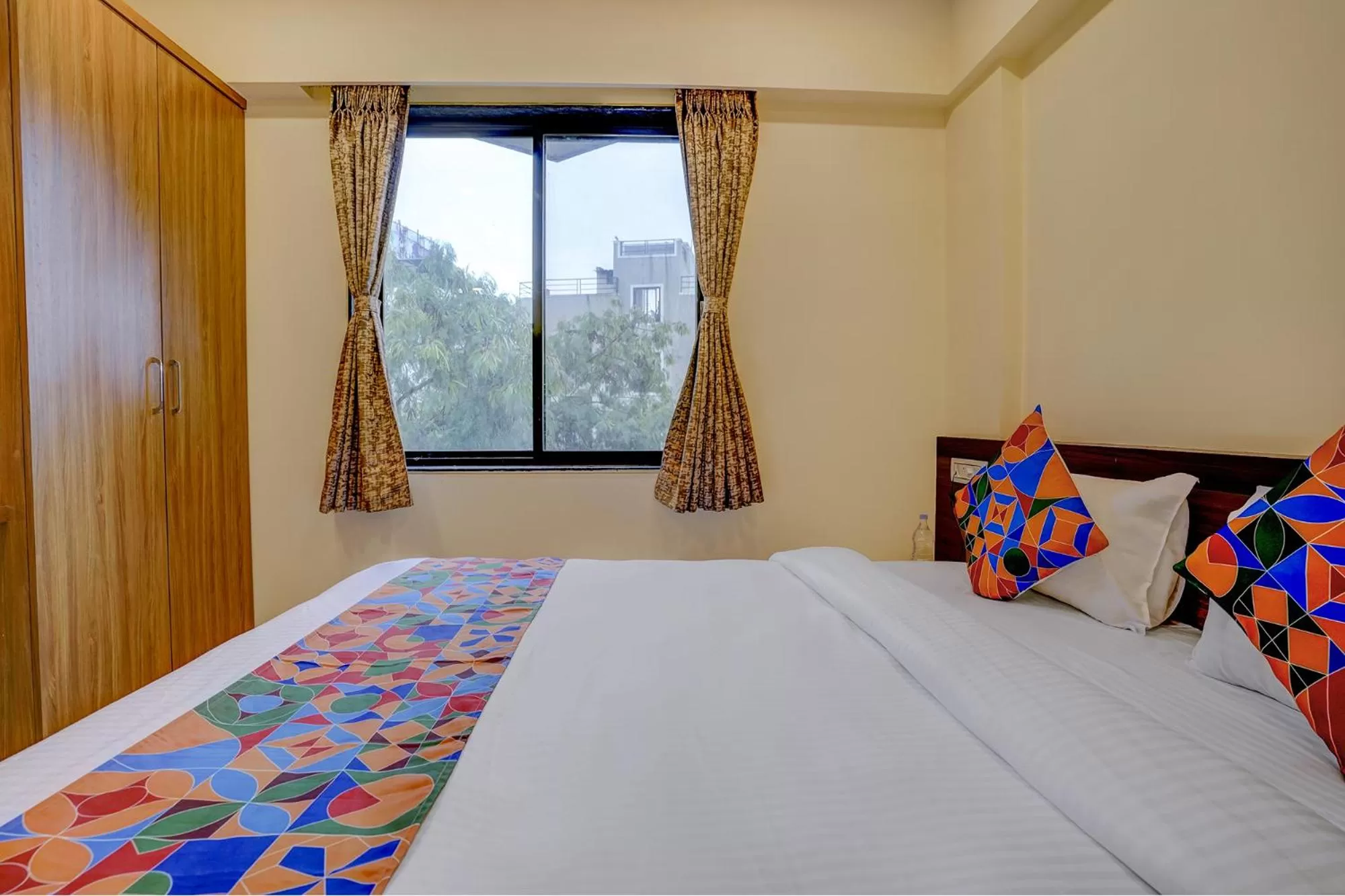 Bed in FabHotel Crystal Homes - nr Rajaram Bhiku stadium