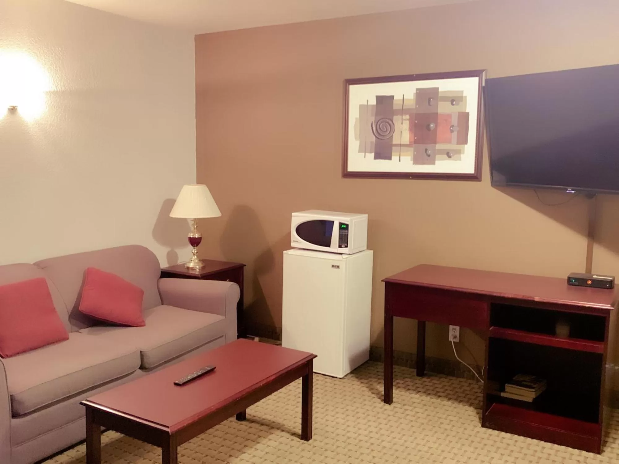 Living room in Ramada by Wyndham Red Deer Hotel & Suites