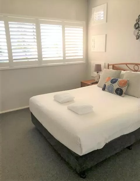 Bed in Sunrise Luxury Apartments