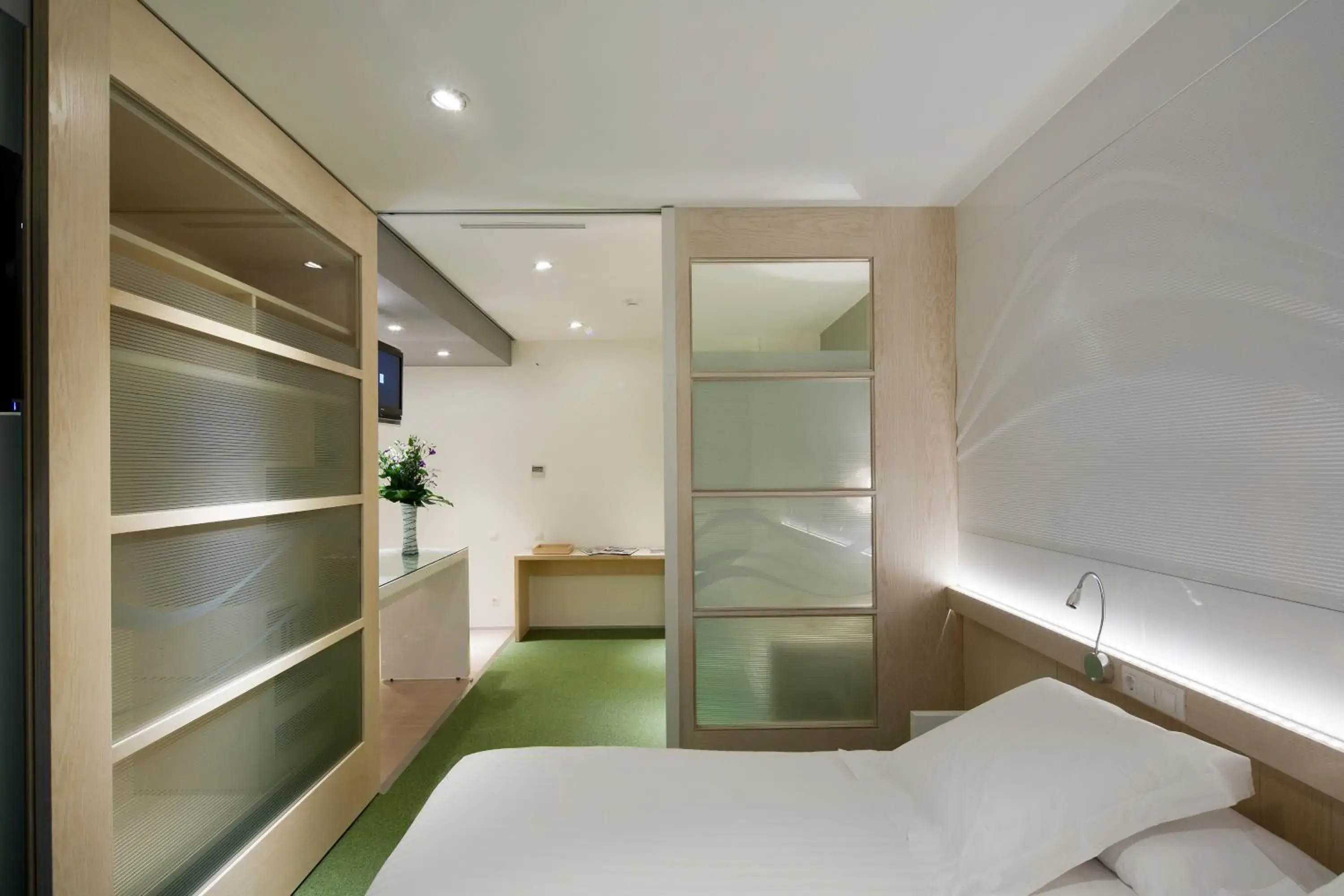 Bedroom in Ako Suites Hotel