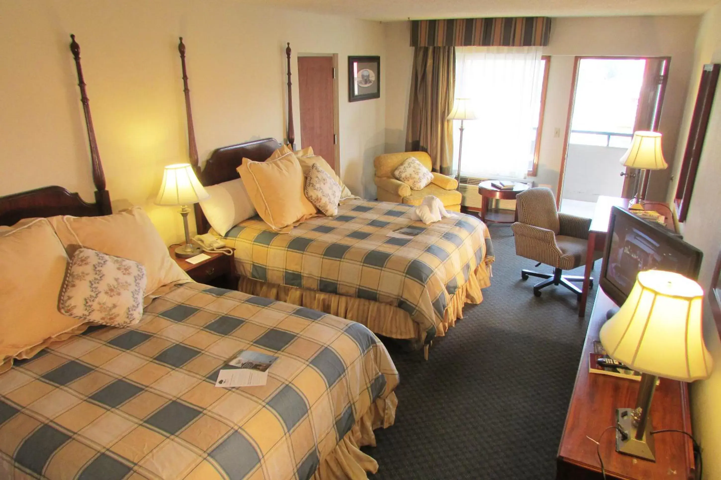 Superior Double Queen Mountain View with Shared Hall Balcony and Rocking Chairs in Arbors at Island Landing Hotel & Suites